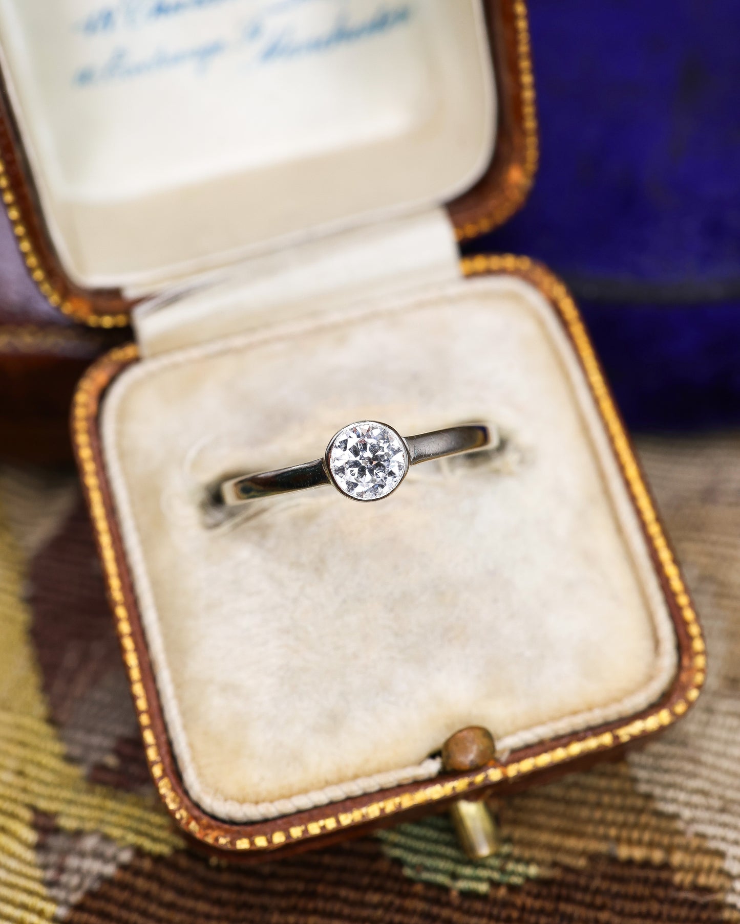 A very fine 14 ct White Gold (marked) Diamond Solitaire Ring, centrally "Rub Over Set" with one "Old Round Cut" Diamond of approximately 0.30 Carats. Circa 1960 - Robin Haydock Antique Jewellery