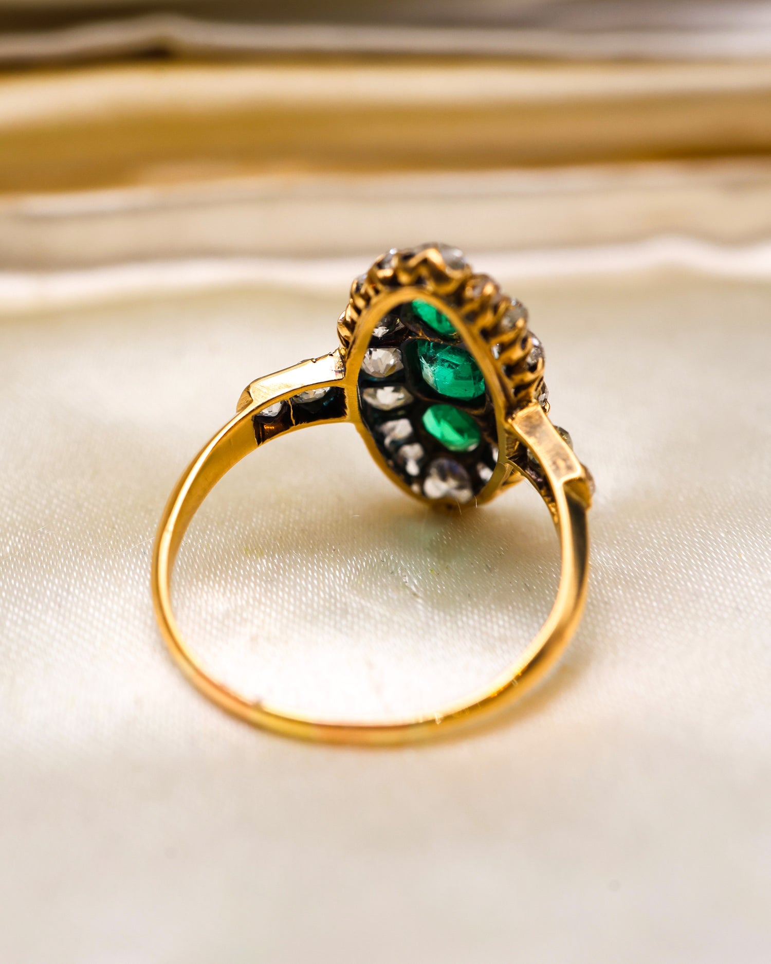 A very fine antique 18 ct. Yellow Gold (tested),  Navette shaped ring set with three Octagonal Step Cut Natural Emeralds & numerous Diamonds, with Diamond set shoulders. English. Circa 1870. - Robin Haydock Antique Jewellery
