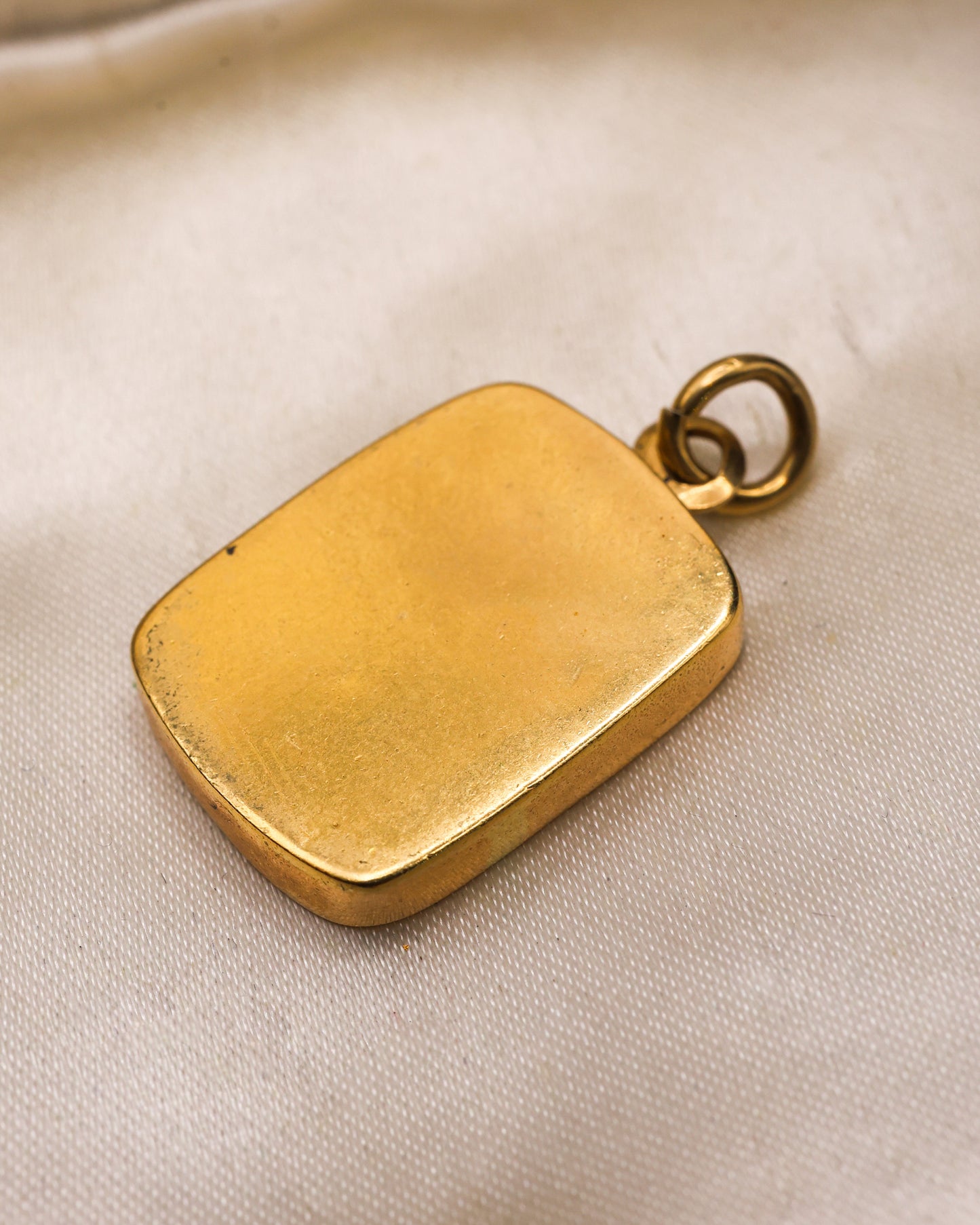 A very fine mid-18th Century, Bloodstone Erotic Intaglio, in a later 9ct English Yellow Gold Pendant Frame with articulated bail. Intaglio probably Italian, Circa 1750.