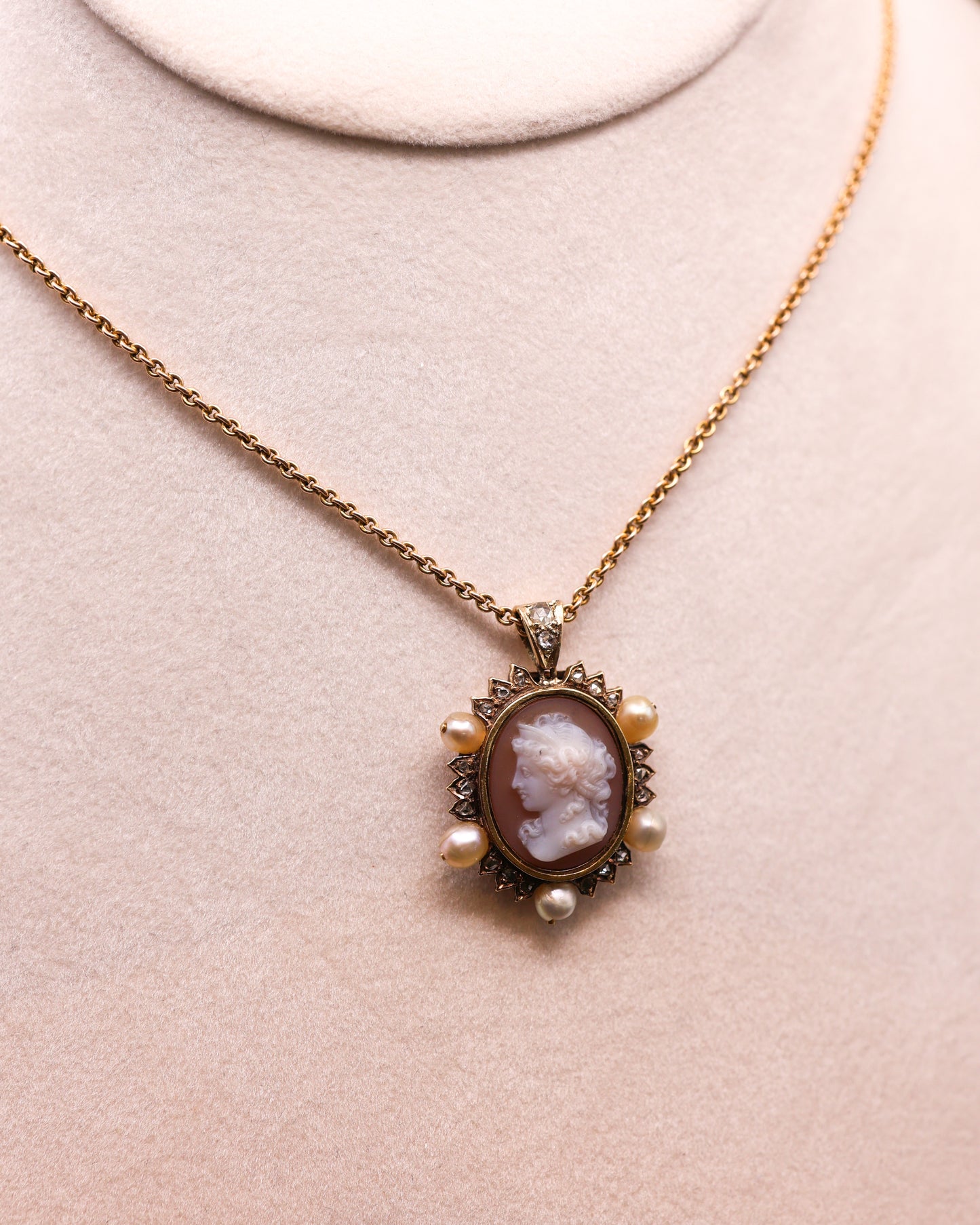 A very fine Hard stone (Carnelian), Cameo Pendant surrounded by five Natural Pearls and Diamonds in 15 carat (tested), Yellow Gold. Circa 1870