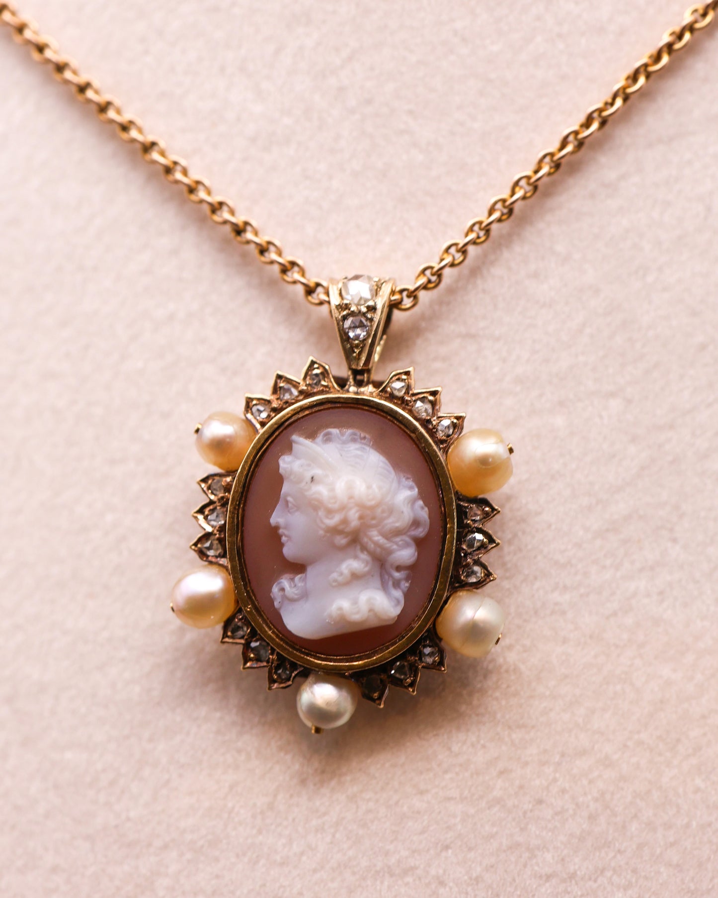 A very fine Hard stone (Carnelian), Cameo Pendant surrounded by five Natural Pearls and Diamonds in 15 carat (tested), Yellow Gold. Circa 1870