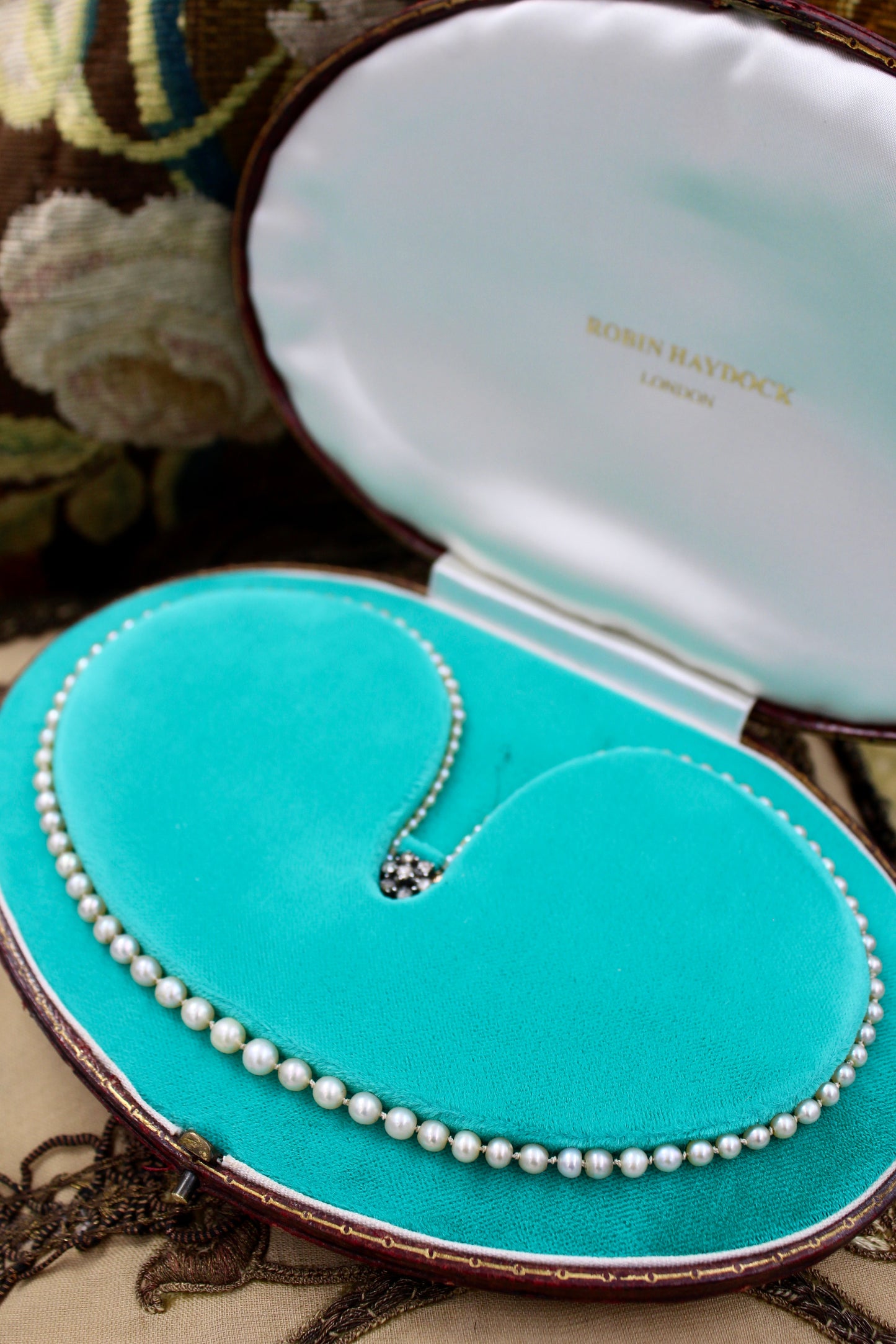 A very fine Graduated Natural Pearl Necklace with a High Carat and Silver Old Cut Diamond Set Clasp. Circa 1920 - Robin Haydock Antiques