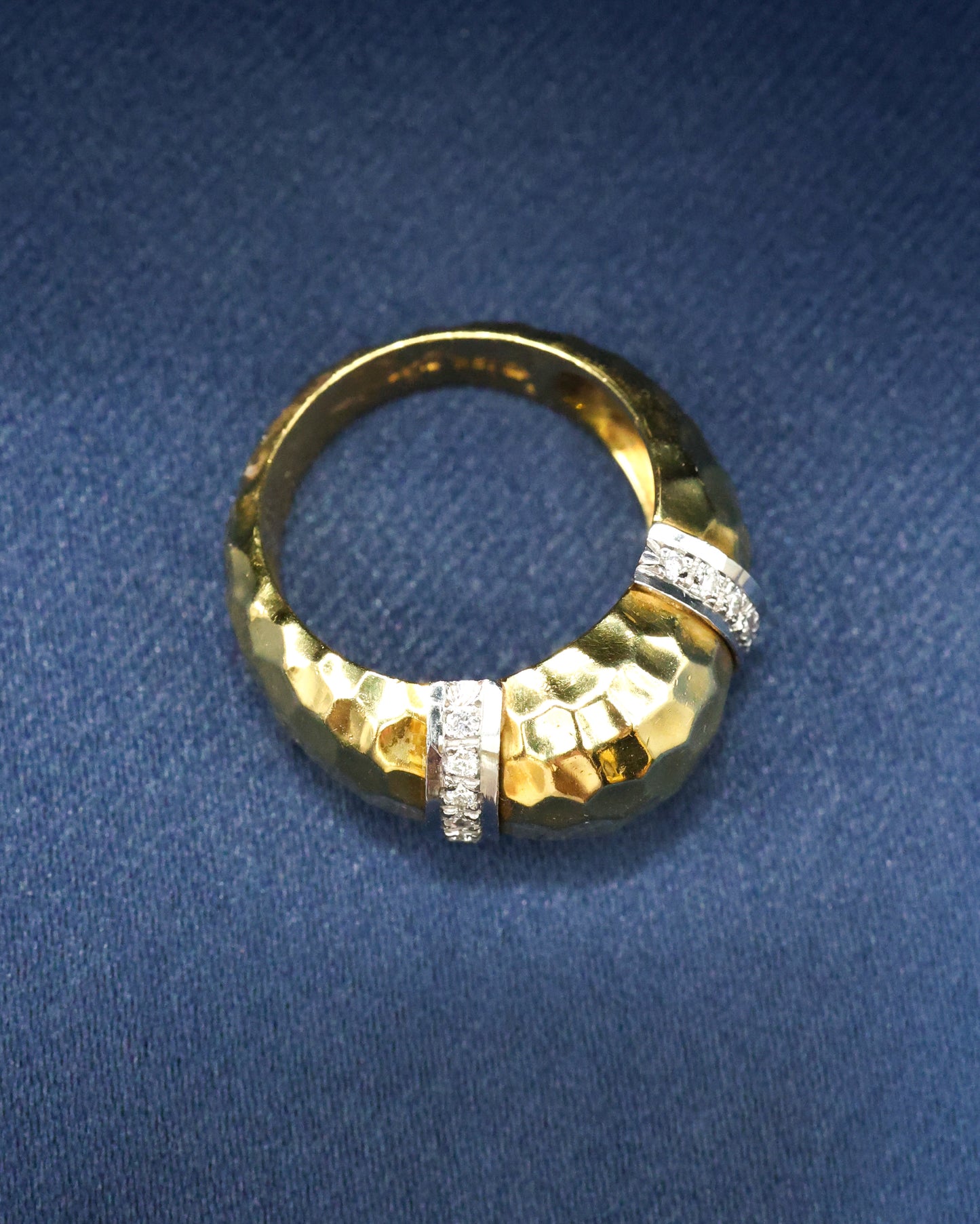 A very finely hammered 18 ct Yellow Gold & Platinum (marked) Ring, with two cordons in Platinum, each set with ten small round cut Diamonds (20 in total). Continental. Circa 1960