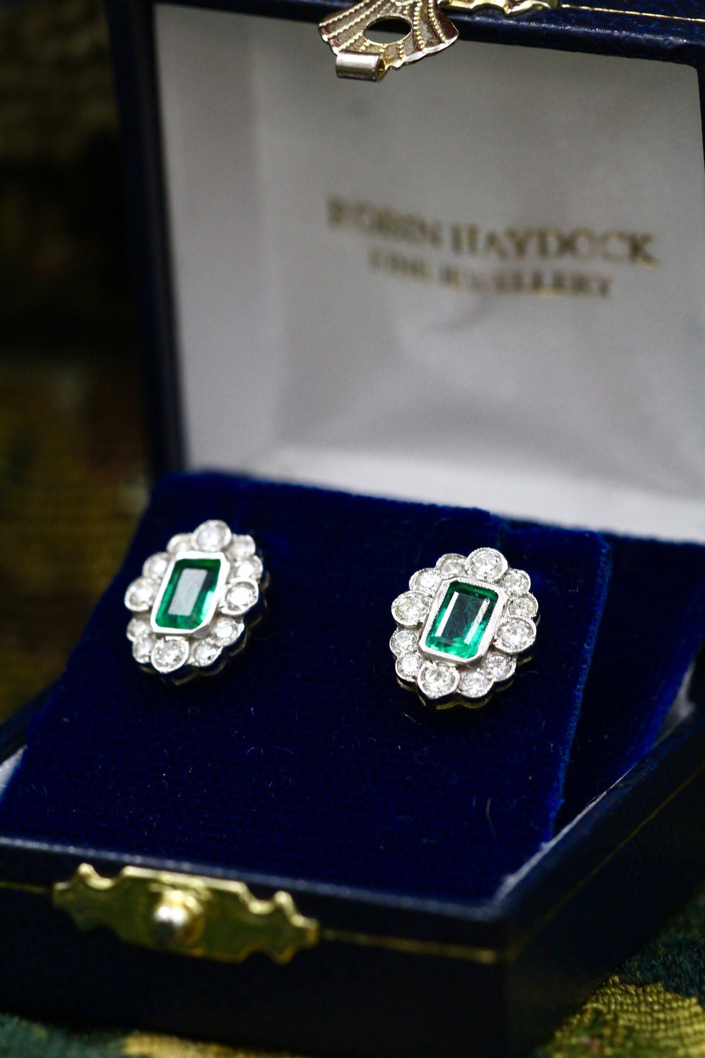 A fine pair of Oval Emerald & Diamond, 18 ct White & Yellow Gold (stamped 750) Cluster Earrings. Pre-owned - Robin Haydock Antiques
