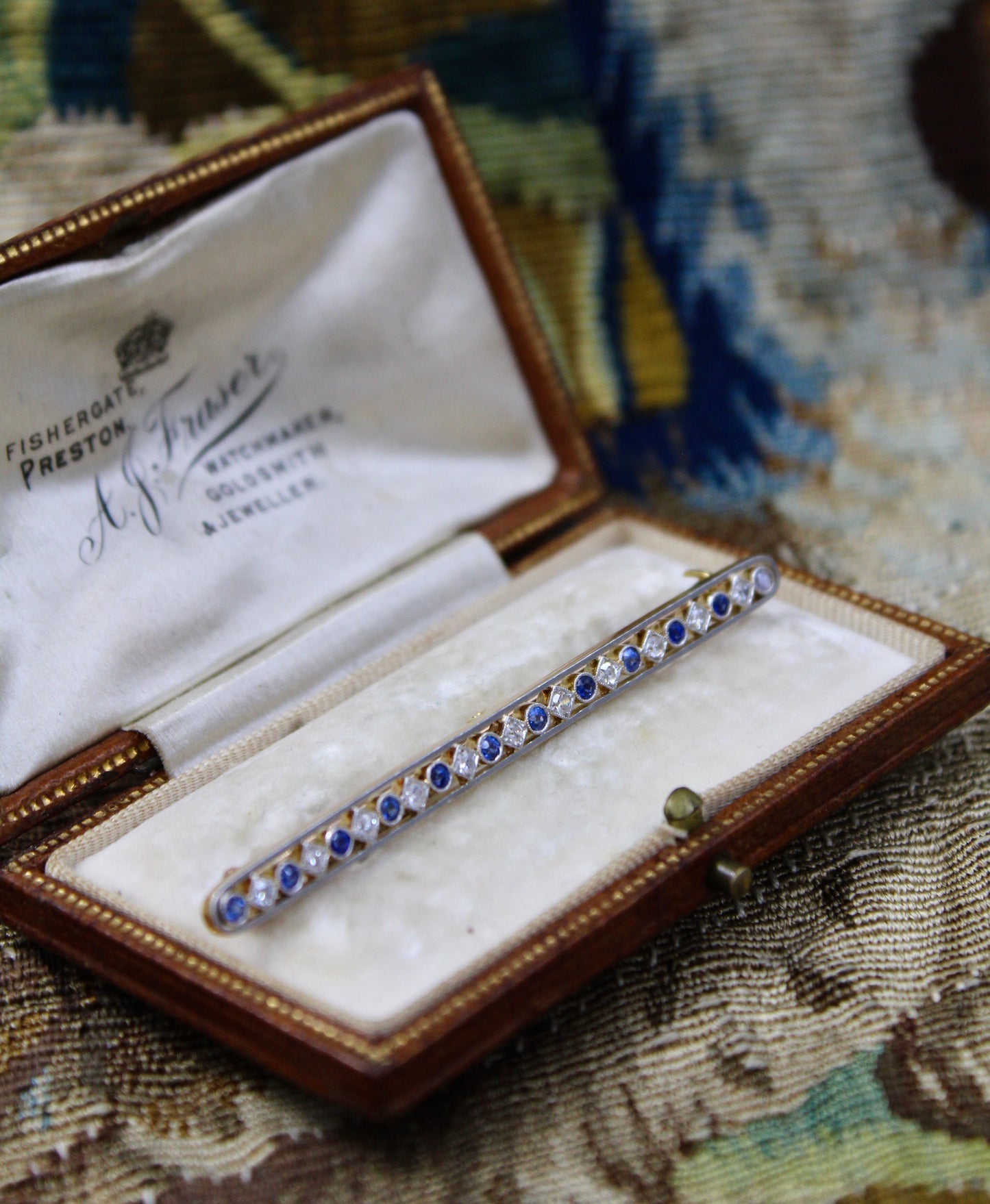 A very fine Diamond and Sapphire, Bar Brooch, in 18 Carat Yellow Gold (Tested) and Platinum, Circa 1920. - Robin Haydock Antiques