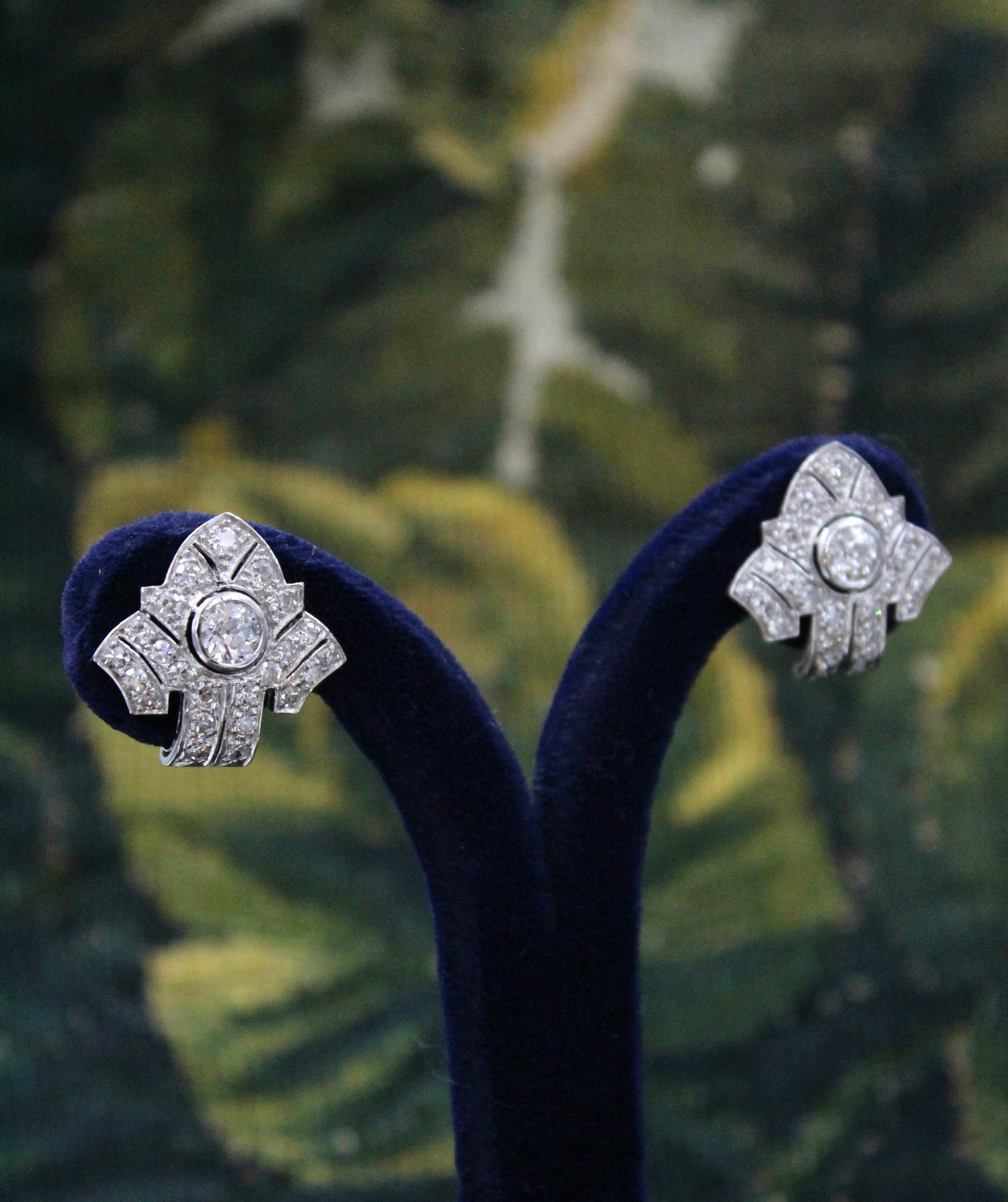 An exceptional pair of Platinum and 18 Carat White Gold Diamond Earrings, set with two Round Brilliant Cut Diamonds and Forty Six Round Brilliant Cut Natural Diamonds on the sides. - Robin Haydock Antiques