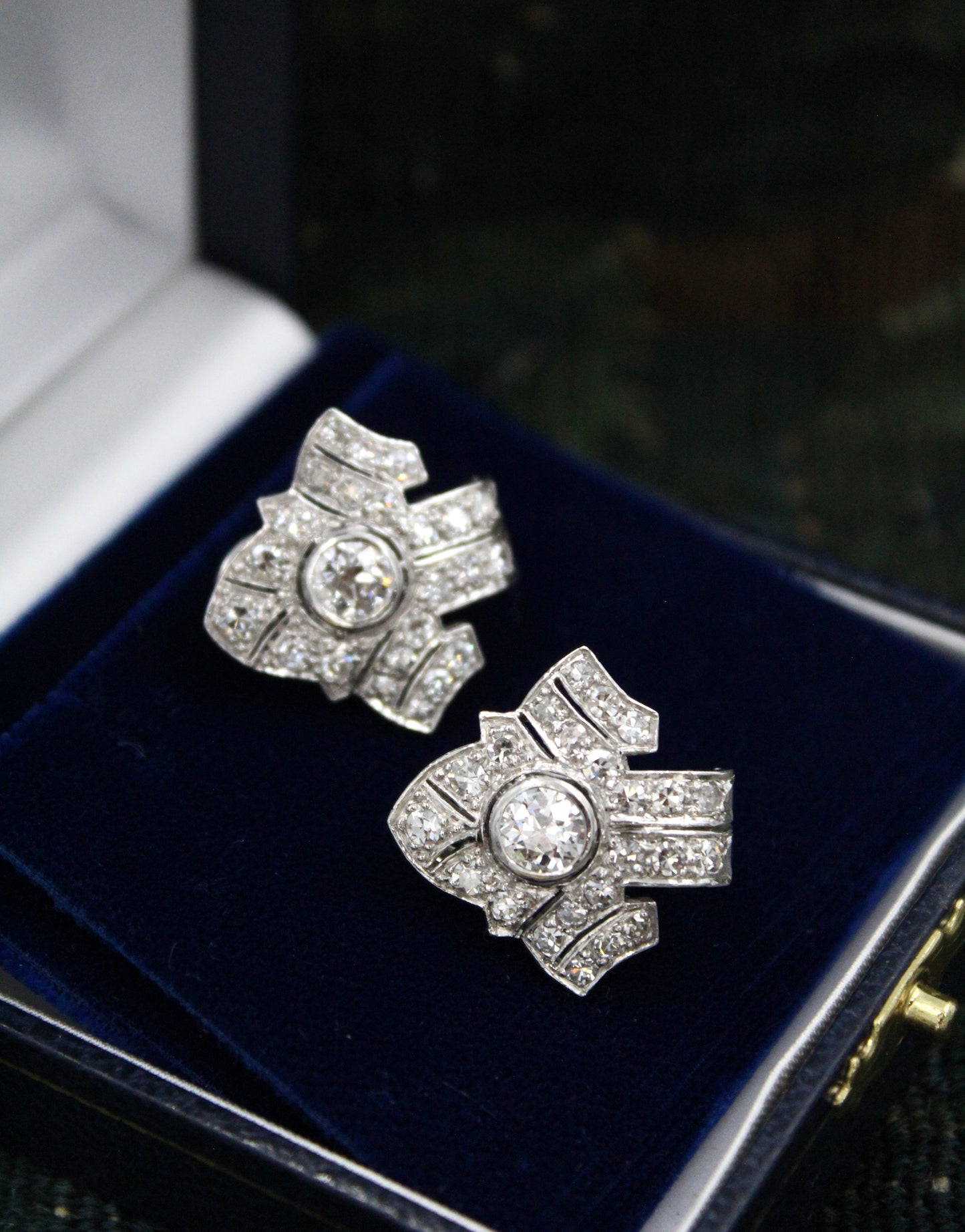 An exceptional pair of Platinum and 18 Carat White Gold Diamond Earrings, set with two Round Brilliant Cut Diamonds and Forty Six Round Brilliant Cut Natural Diamonds on the sides. - Robin Haydock Antiques
