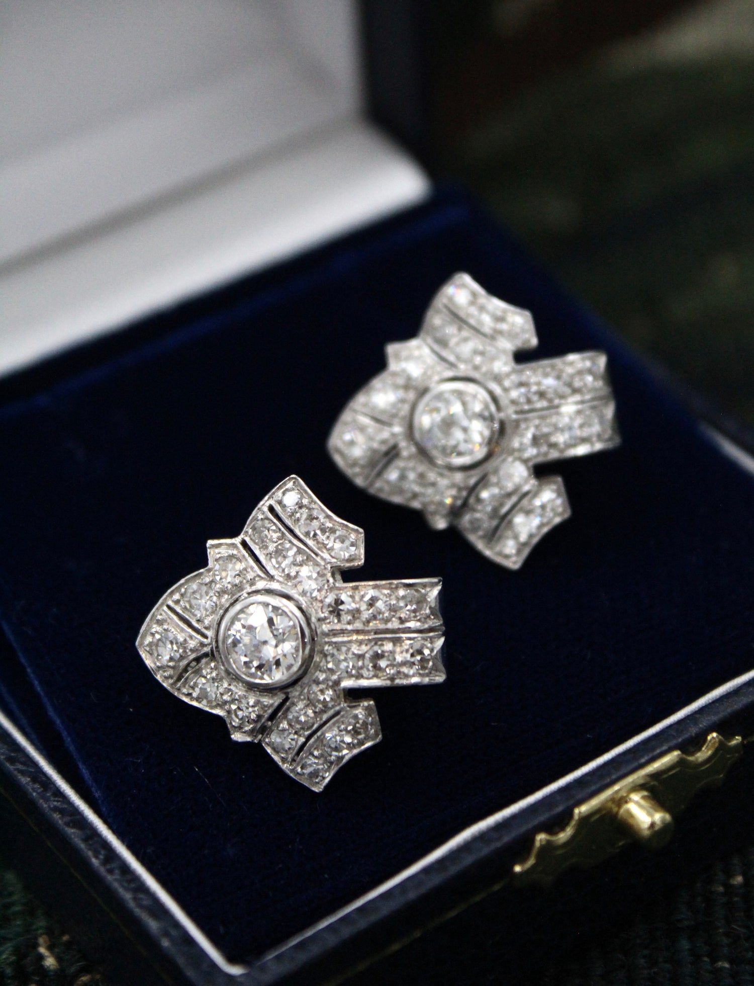 An exceptional pair of Platinum and 18 Carat White Gold Diamond Earrings, set with two Round Brilliant Cut Diamonds and Forty Six Round Brilliant Cut Natural Diamonds on the sides. - Robin Haydock Antiques