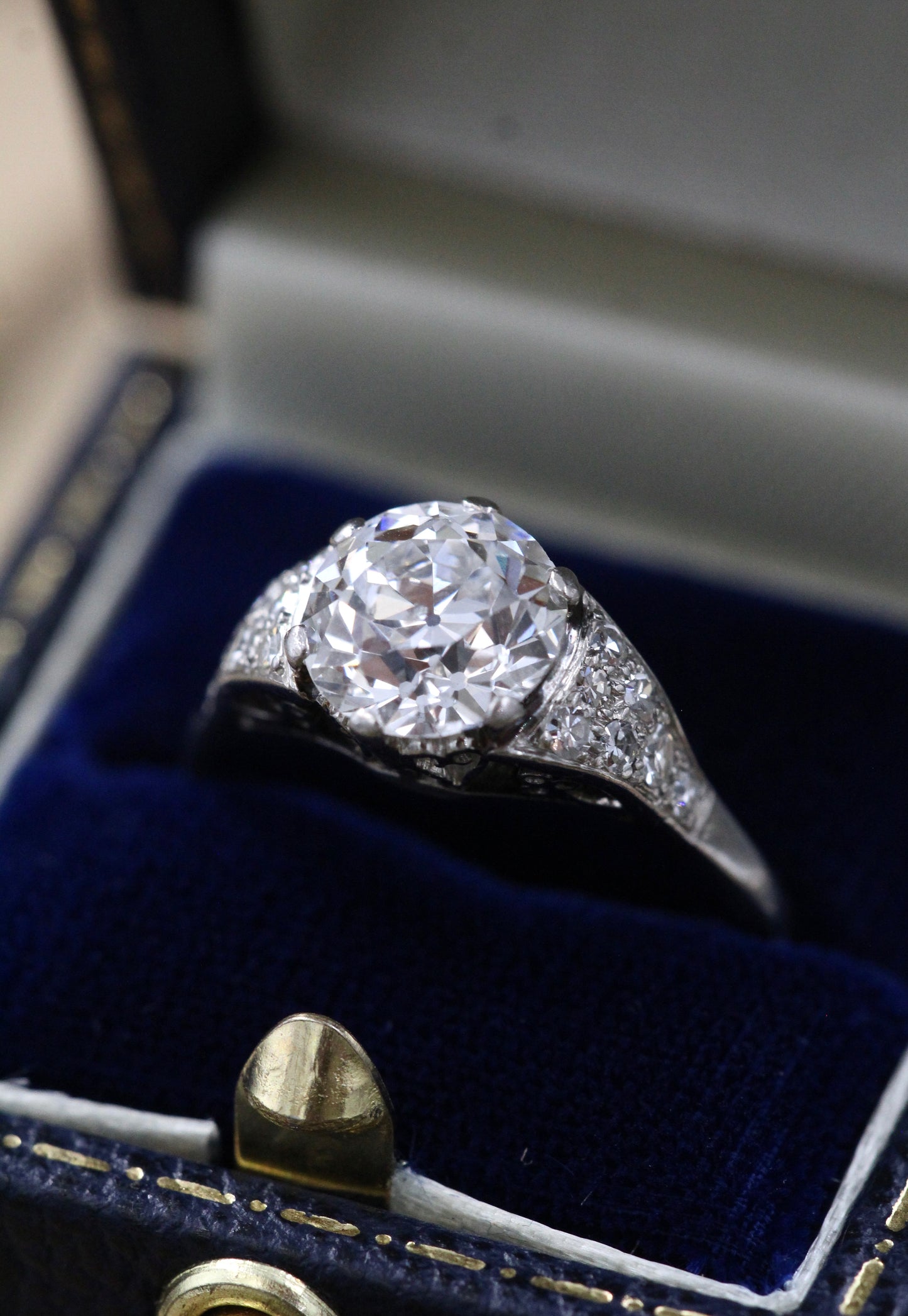 A very fine Platinum & Diamond Solitaire Ring, set with an Old European Cut Diamond, of 2.18 Carats, G Colour and SI1 Clarity. Offset by graduated Diamond Shoulders. Circa 1925 - Robin Haydock Antiques