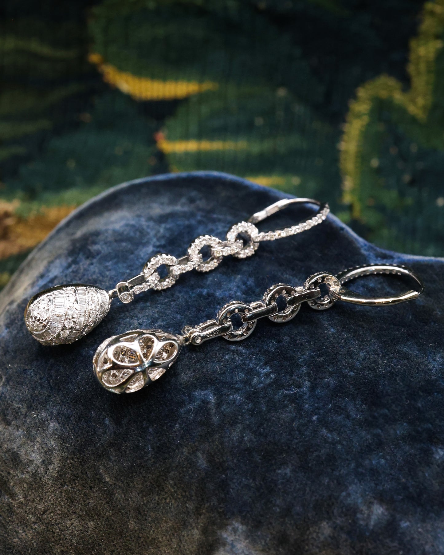 A fine pair of 18ct White Gold (marked), Round Brilliant & Emerald Cut Diamond Drop Earrings. approximately 1.35 Carats (unweighed). Pre-owned.