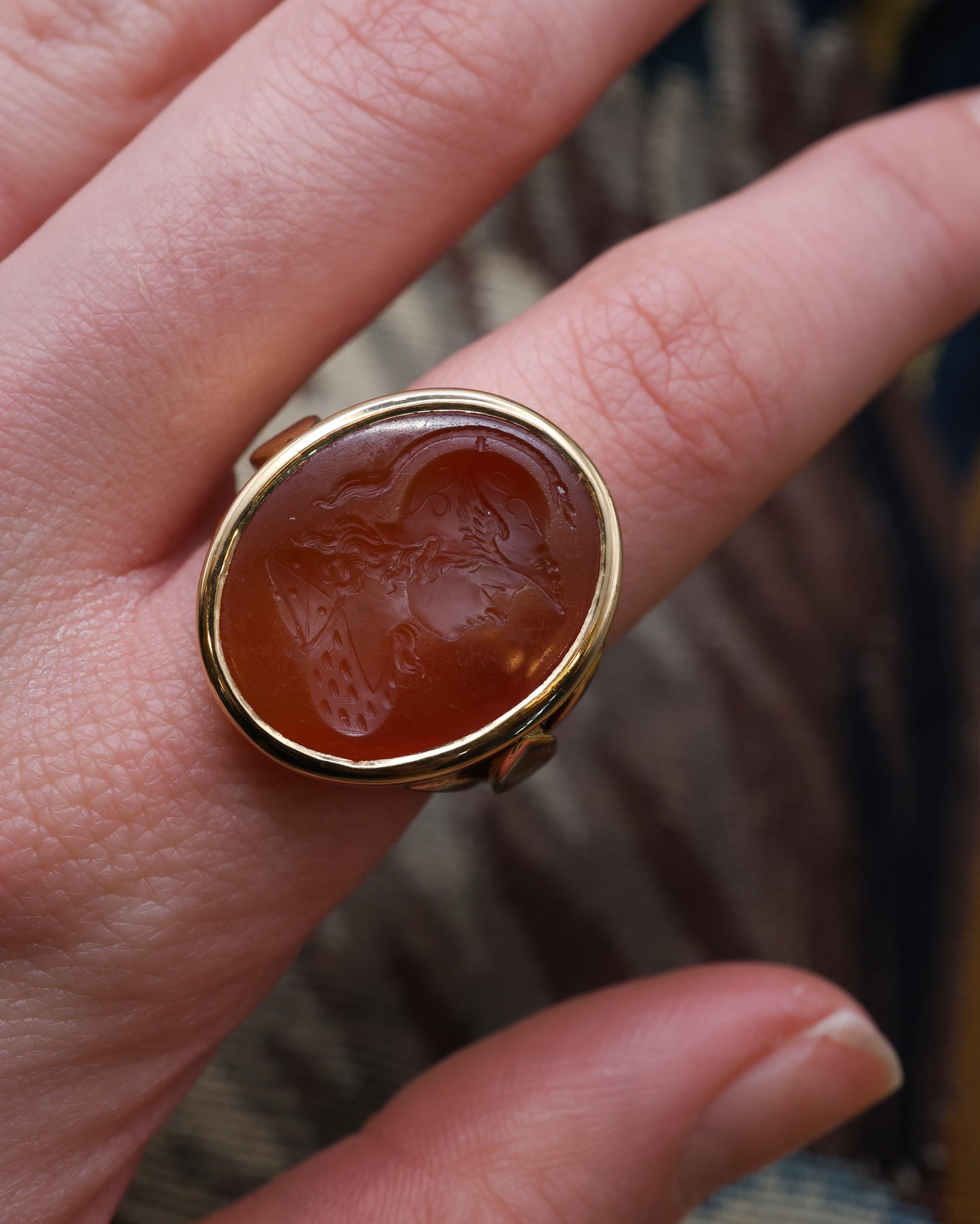 An unusually heavy 18ct Yellow Gold (tested), Oval Carnelian Intaglio ring, finely carved with the image of a warrior wearing a Winged Helmet (Hermes - Mercury), partial hallmarks. English. Circa 1890