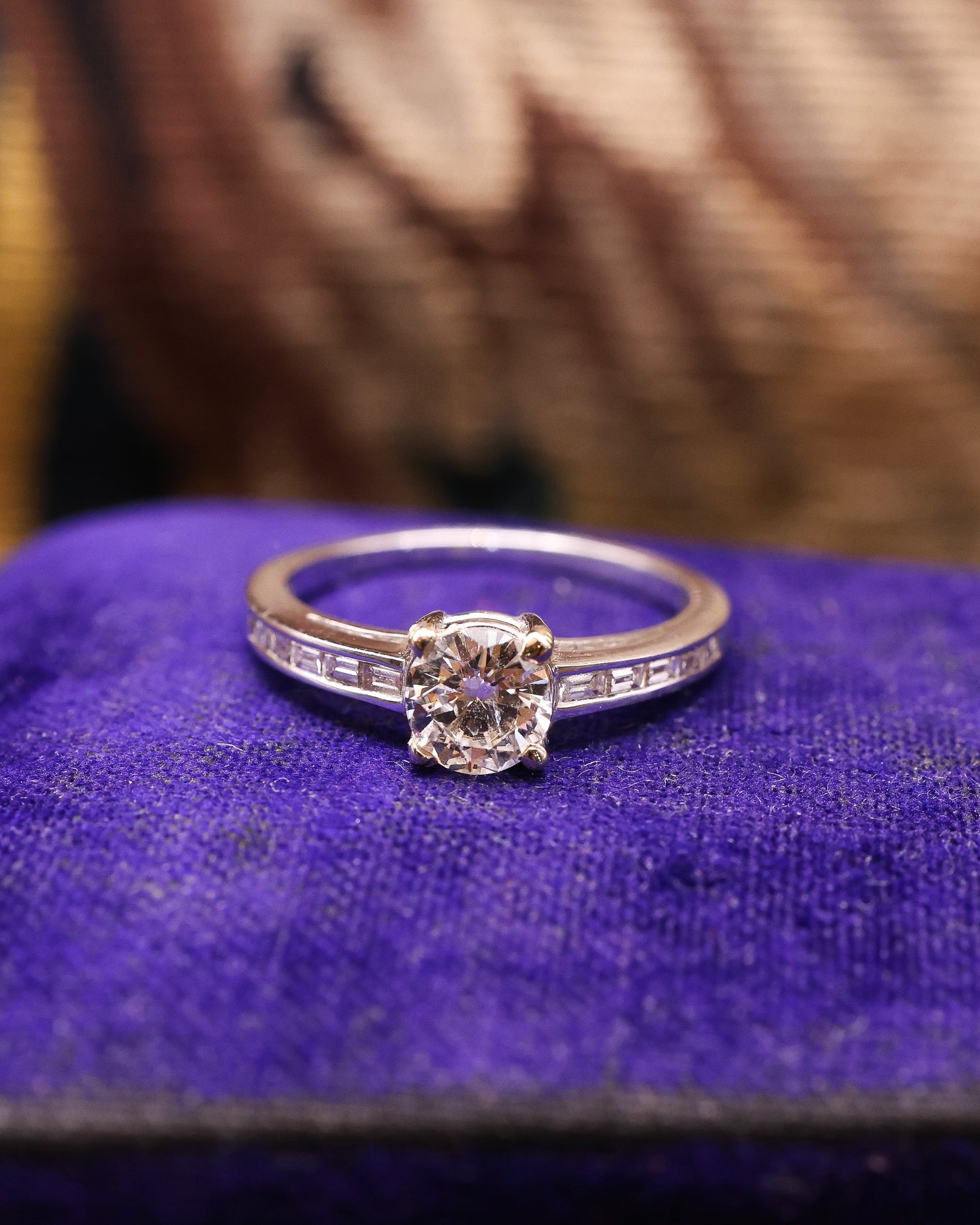 A very fine 18 ct White Gold Diamond  Solitaire Ring, 0.66 Carats Approximately, with shoulder settings of 0.18 Carats (stamped) of Modified Step Cut Diamonds.  Preowned - Robin Haydock Antique Jewellery