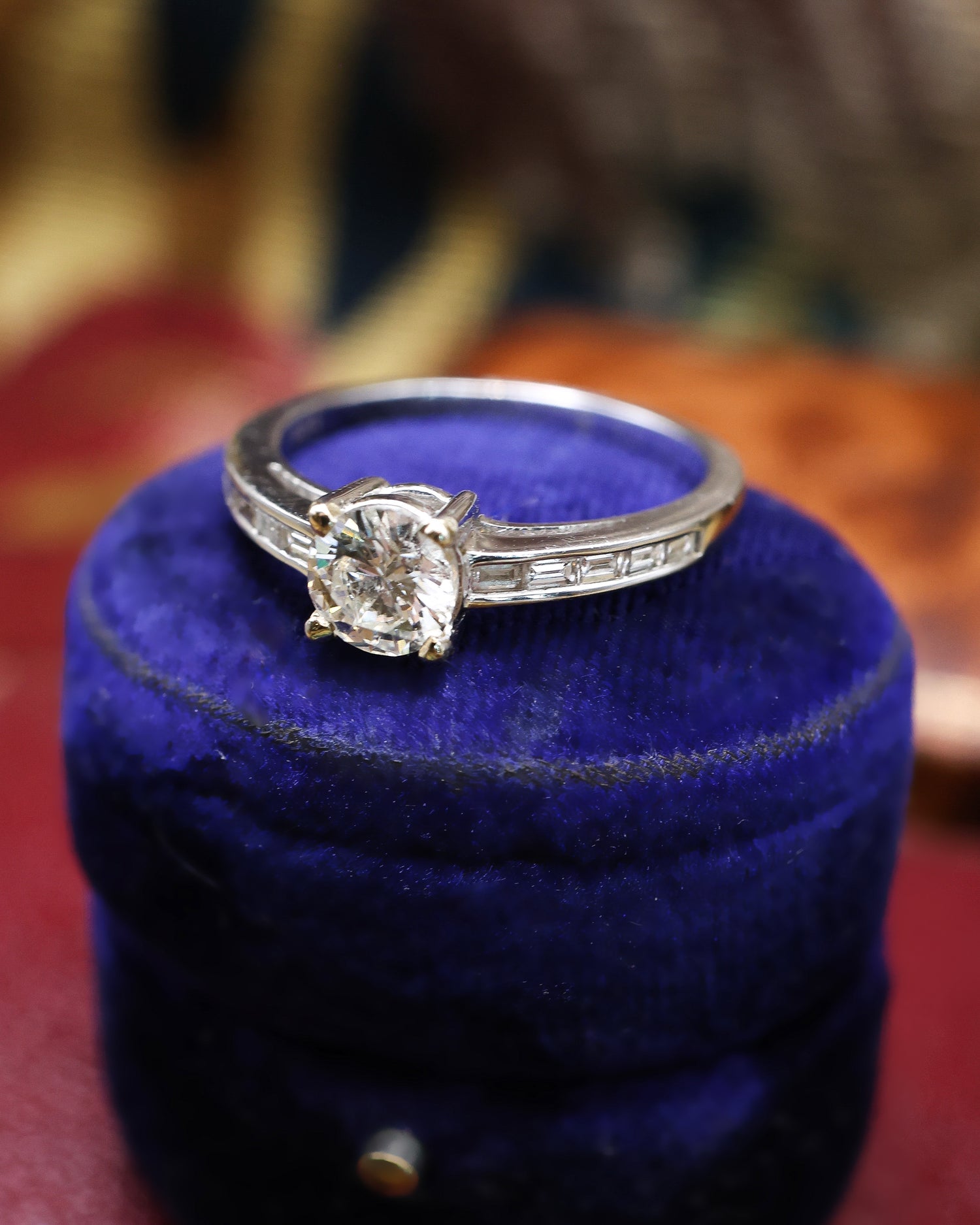 A very fine 18 ct White Gold Diamond  Solitaire Ring, 0.66 Carats Approximately, with shoulder settings of 0.18 Carats (stamped) of Modified Step Cut Diamonds.  Preowned - Robin Haydock Antique Jewellery