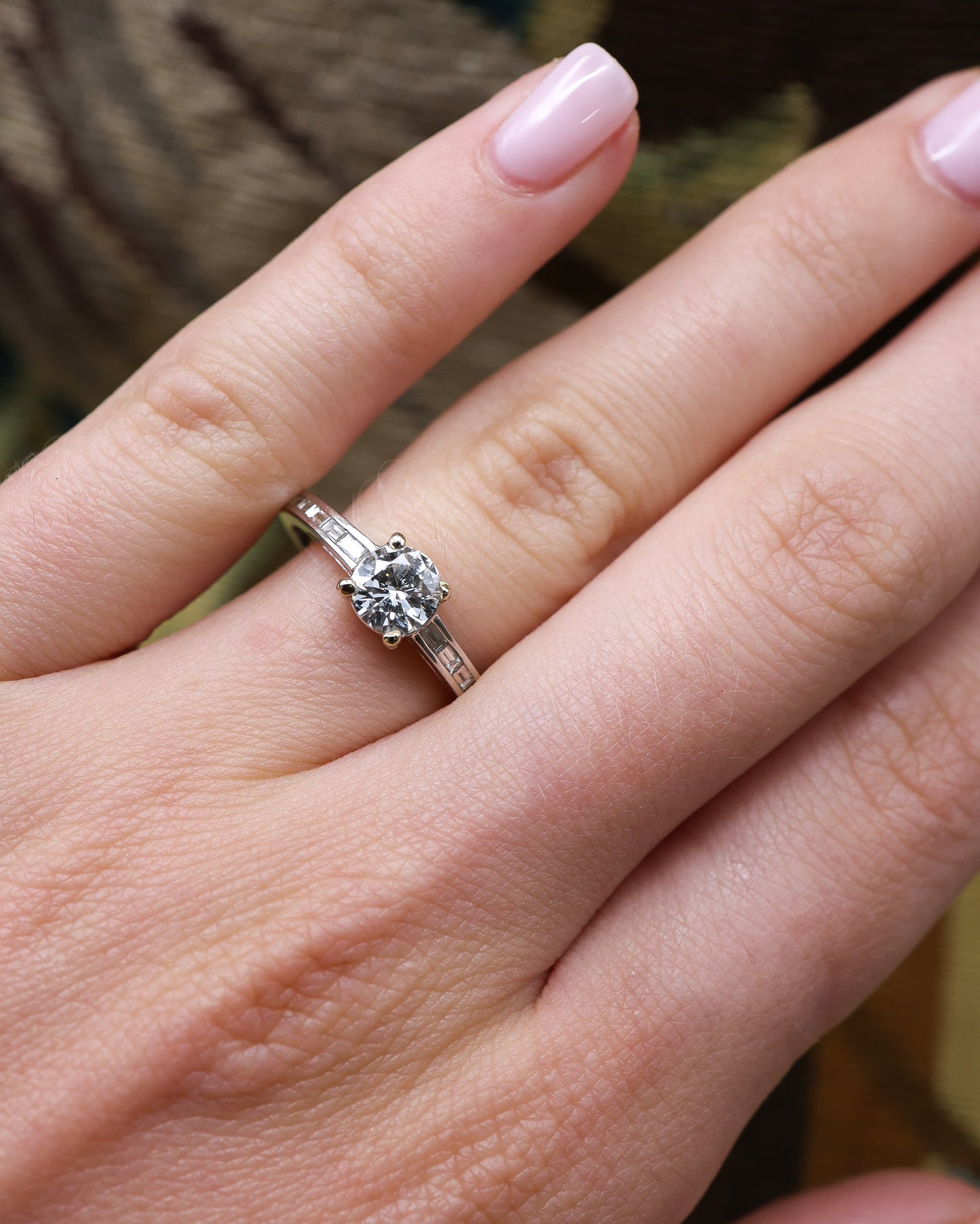 A very fine 18 ct White Gold Diamond Solitaire Ring, 0.66 Carats Approximately, with shoulder settings of 0.18 Carats (stamped) of Modified Step Cut Diamonds. Preowned - Robin Haydock Antique Jewellery