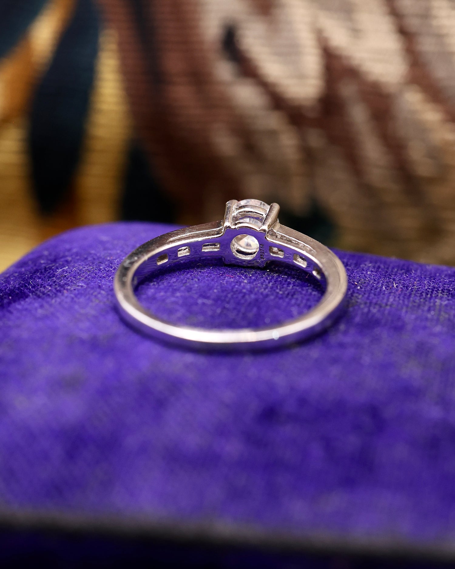 A very fine 18 ct White Gold Diamond  Solitaire Ring, 0.66 Carats Approximately, with shoulder settings of 0.18 Carats (stamped) of Modified Step Cut Diamonds.  Preowned - Robin Haydock Antique Jewellery