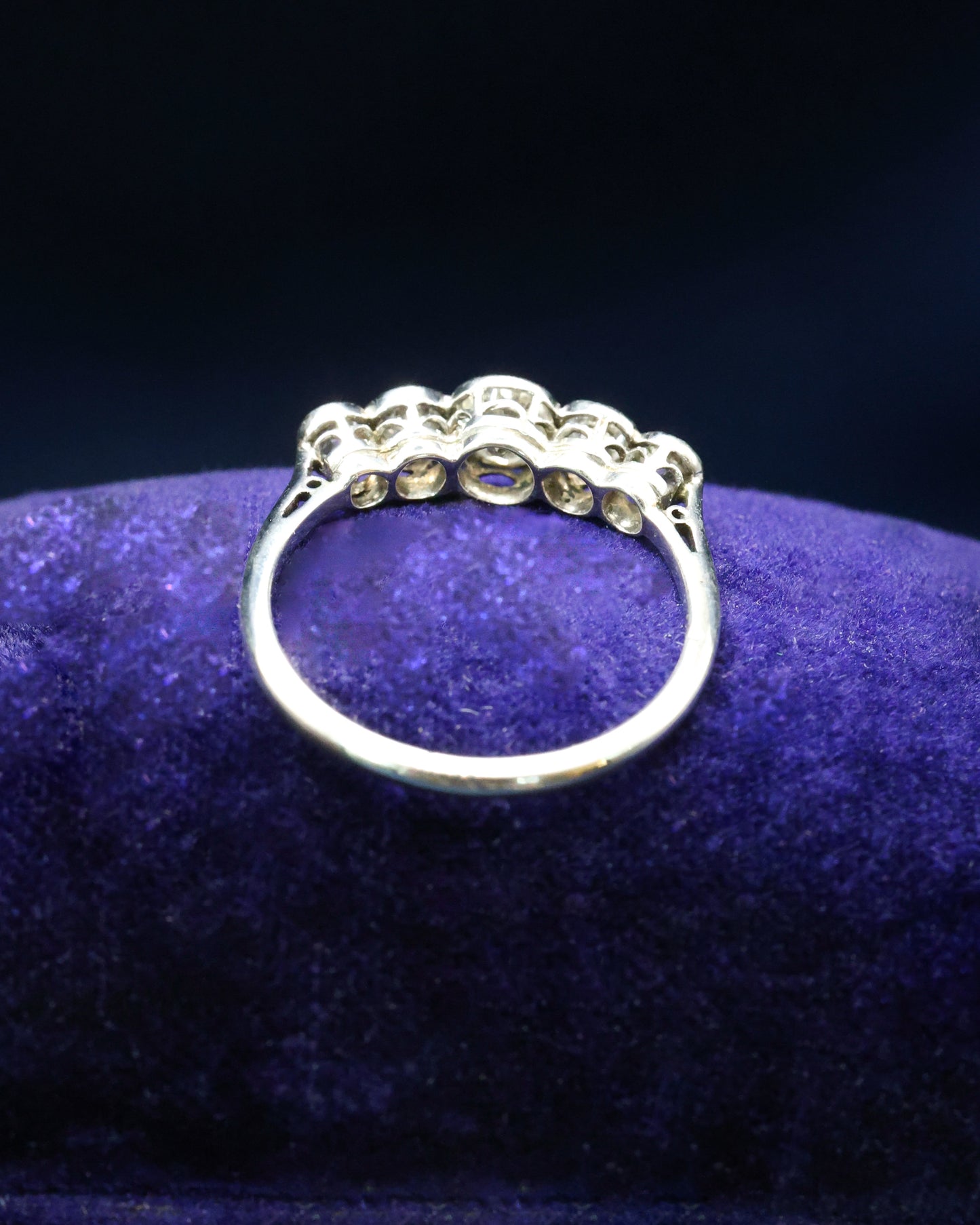 A very fine 18ct. White Gold (later rhodium plated), graduating five stone Diamond Ring, rub-over and granulated set with five Old European Cut, Natural Diamonds. Circa 1930