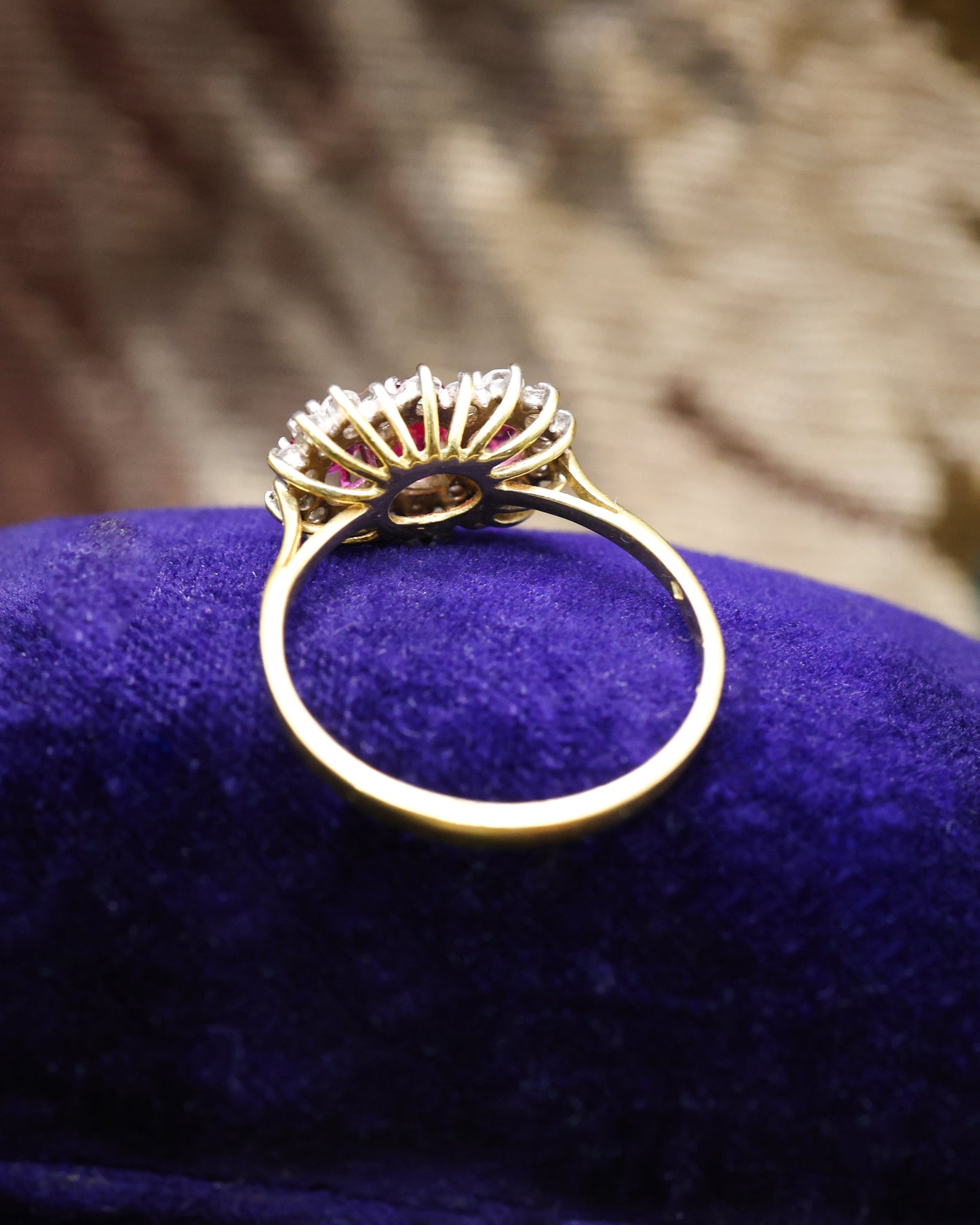 A very unusual 18ct (marked), Yellow Gold & Platinum Tipped, Three Stone Ruby & Diamond Cluster Ring. Circa 1971