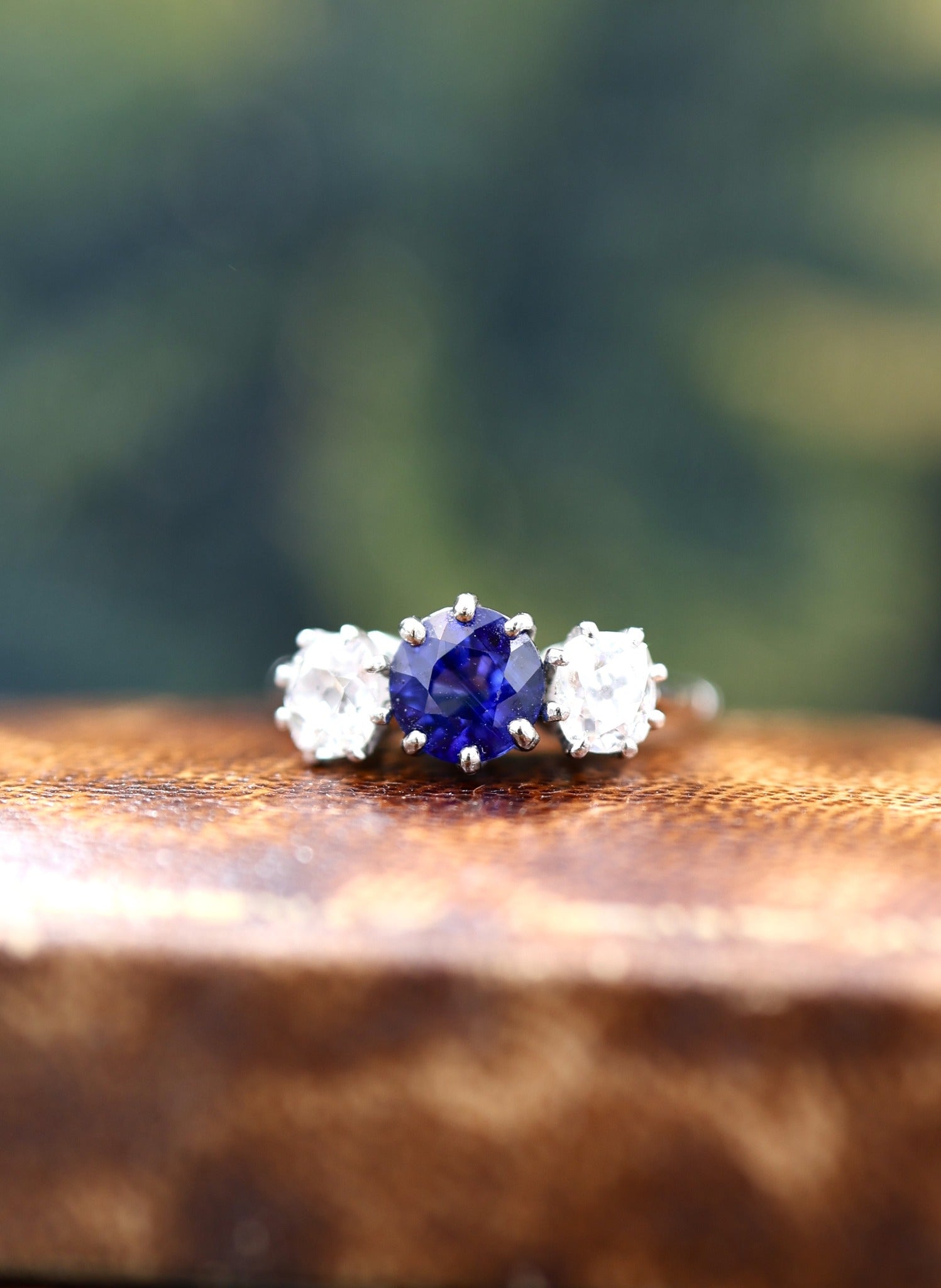 A beautiful Antique 1.45 Carat Natural Ceylon Sapphire and (two) Old Mine Cut Diamond & Platinum Engagement Ring. Circa 1930 - Robin Haydock Antiques