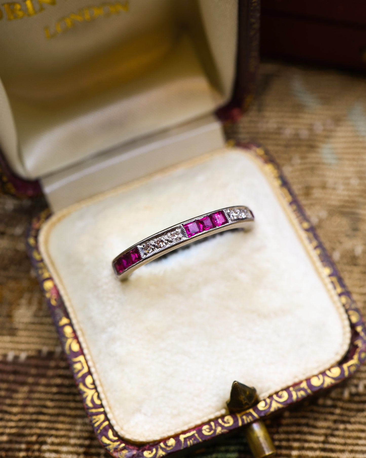 A very fine 18 ct. White Gold Ruby and Diamond Half Eternity Ring, Birmingham Marks for 1966.