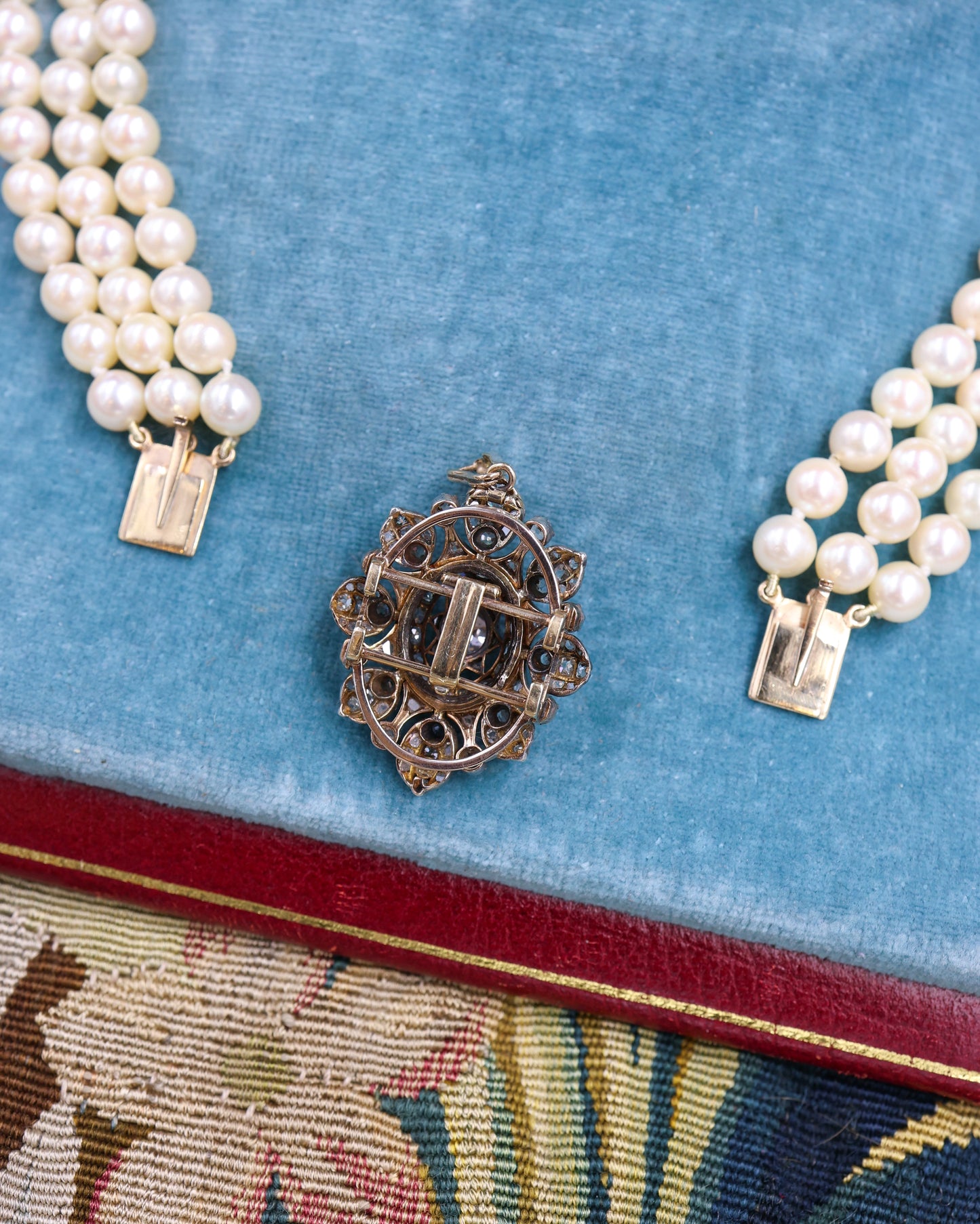 A very fine High Carat (tested), Yellow Gold, Silver tipped Oval Diamond Clasp, with double receipt fasteners for a triple row necklace of Cultured Pearls