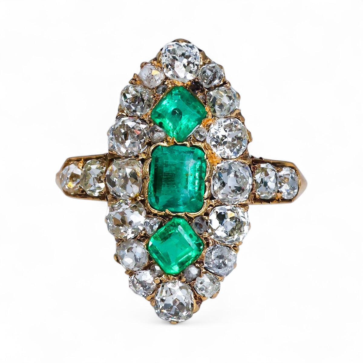 A very fine antique 18 ct. Yellow Gold (tested),  Navette shaped ring set with three Octagonal Step Cut Natural Emeralds & numerous Diamonds, with Diamond set shoulders. English. Circa 1870. - Robin Haydock Antique Jewellery