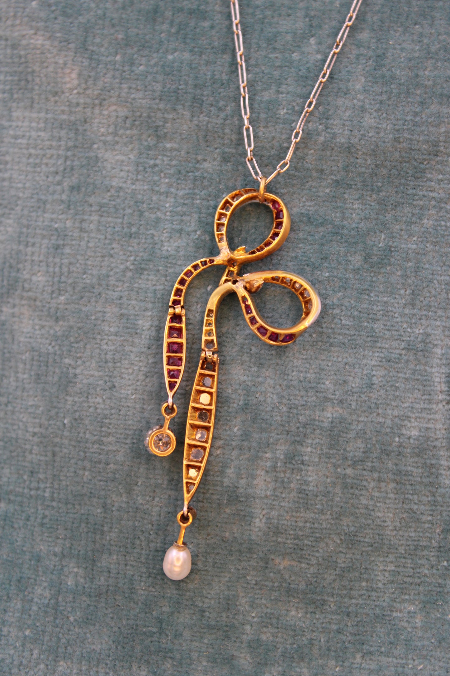 A Diamond, Ruby & Pearl Bow Pendant set in 18ct Yellow Gold and Platinum, Circa 1915 - Robin Haydock Antiques