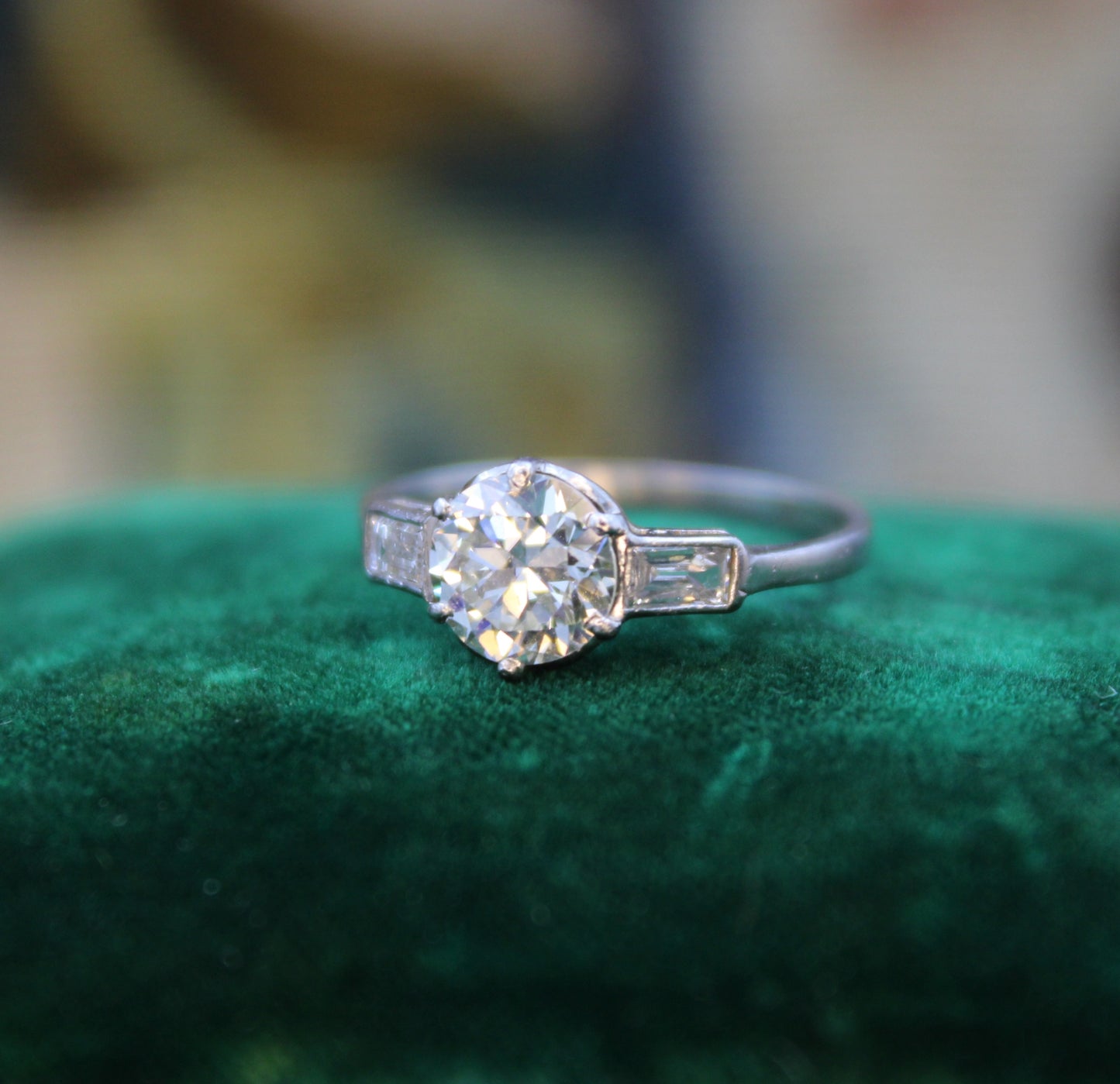 A Beautiful 1.04 Carat, Art Deco, Diamond Solitaire Engagement Ring, with Baguette-cut Diamond  Shoulders, set in Platinum.  Circa 1930 - Robin Haydock Antiques