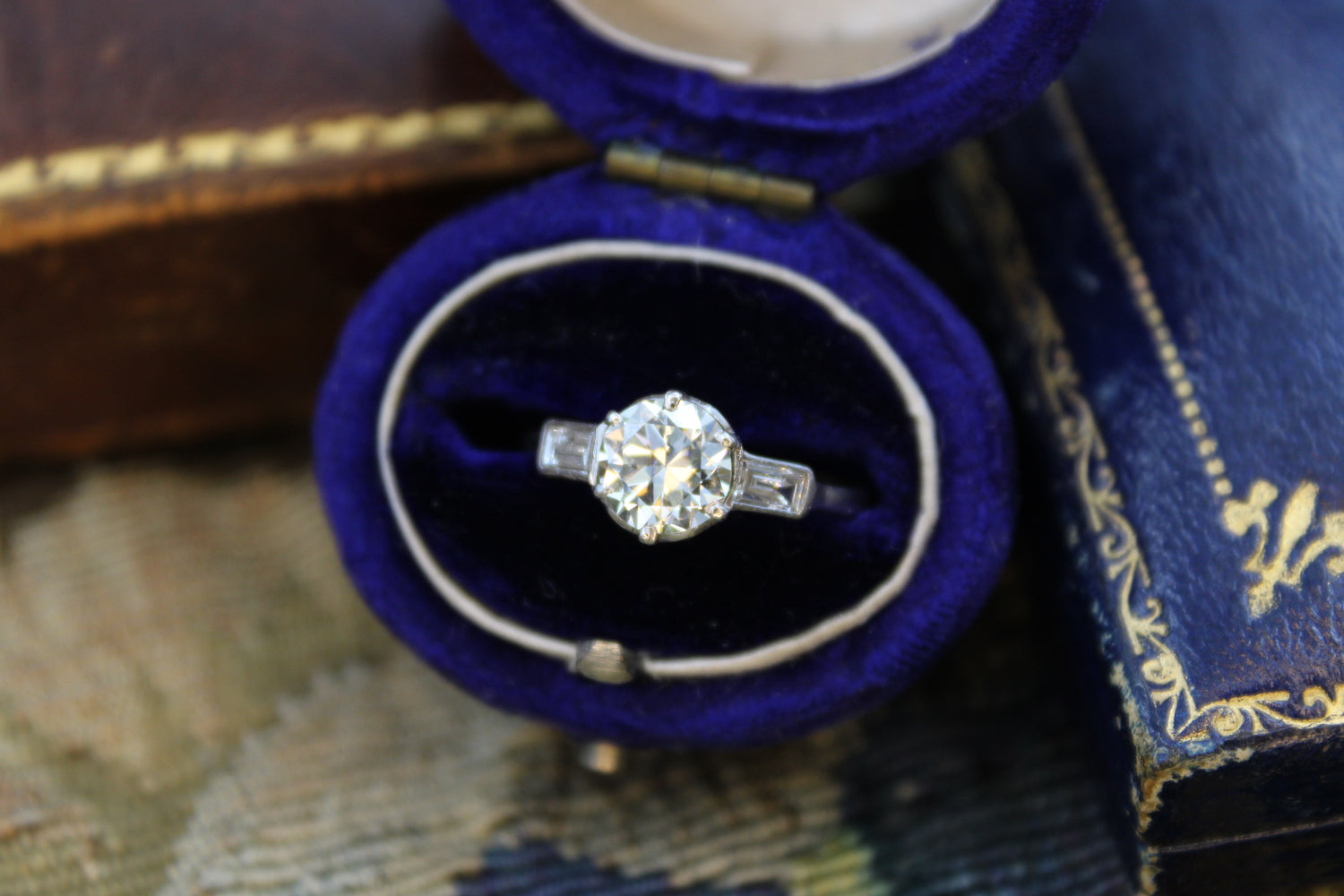 A Beautiful 1.04 Carat, Art Deco, Diamond Solitaire Engagement Ring, with Baguette-cut Diamond  Shoulders, set in Platinum.  Circa 1930 - Robin Haydock Antiques
