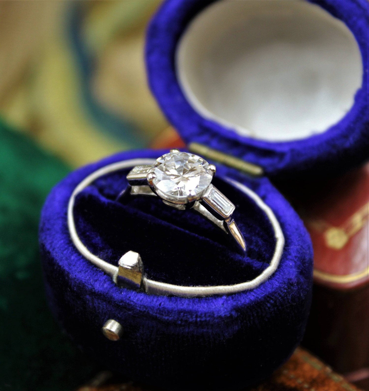 A 1.30ct Diamond Solitaire Ring to Baguette Shoulders mounted in Platinum, Circa 1950 - Robin Haydock Antiques