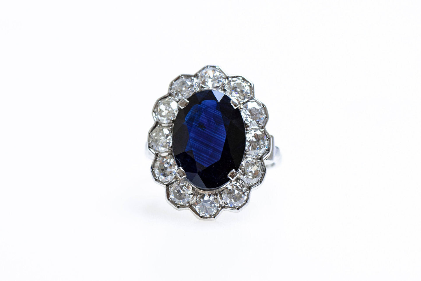 A remarkable Oval Sapphire & Diamond Cluster Ring mounted in Platinum, French, Circa 1935 - Robin Haydock Antiques