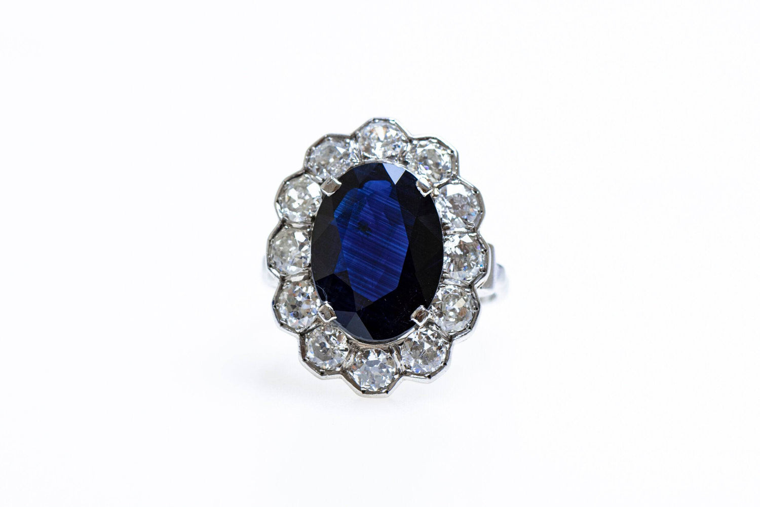 A remarkable Oval Sapphire & Diamond Cluster Ring mounted in Platinum, French, Circa 1935 - Robin Haydock Antiques