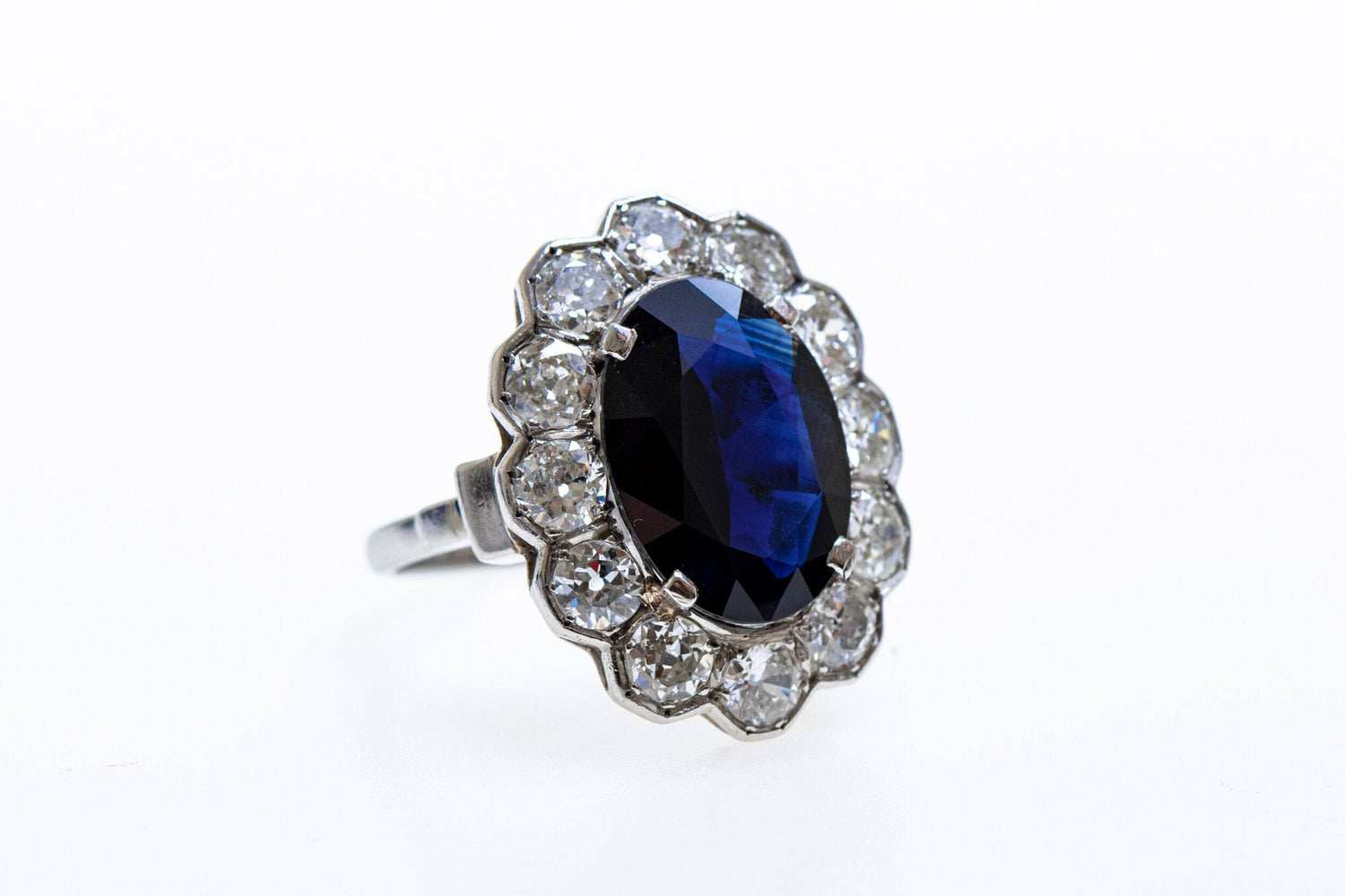 A remarkable Oval Sapphire & Diamond Cluster Ring mounted in Platinum, French, Circa 1935 - Robin Haydock Antiques