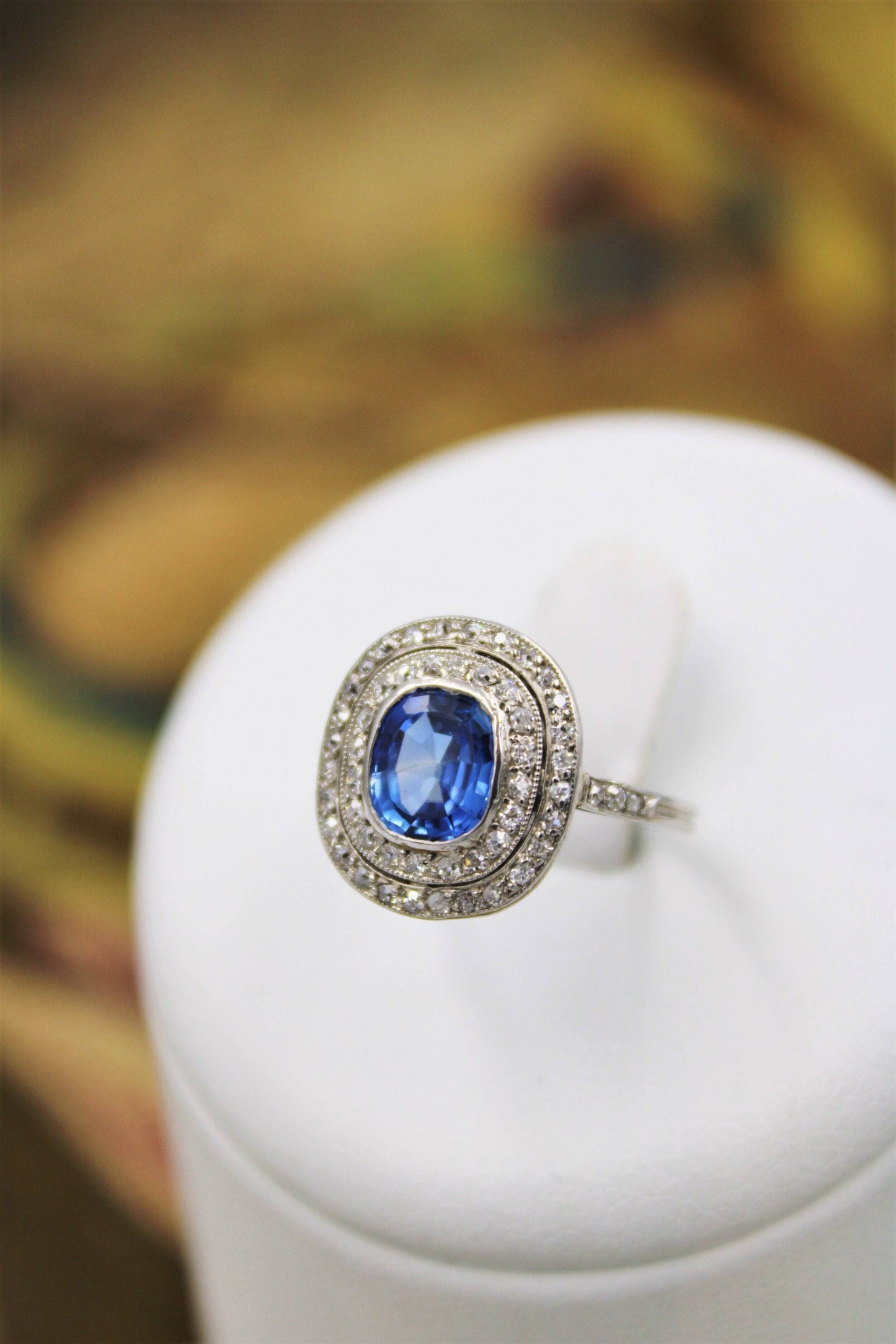 A fine Platinum Oval Ceylon Sapphire & Double Diamond Cluster Ring, Circa 1940. - Robin Haydock Antiques