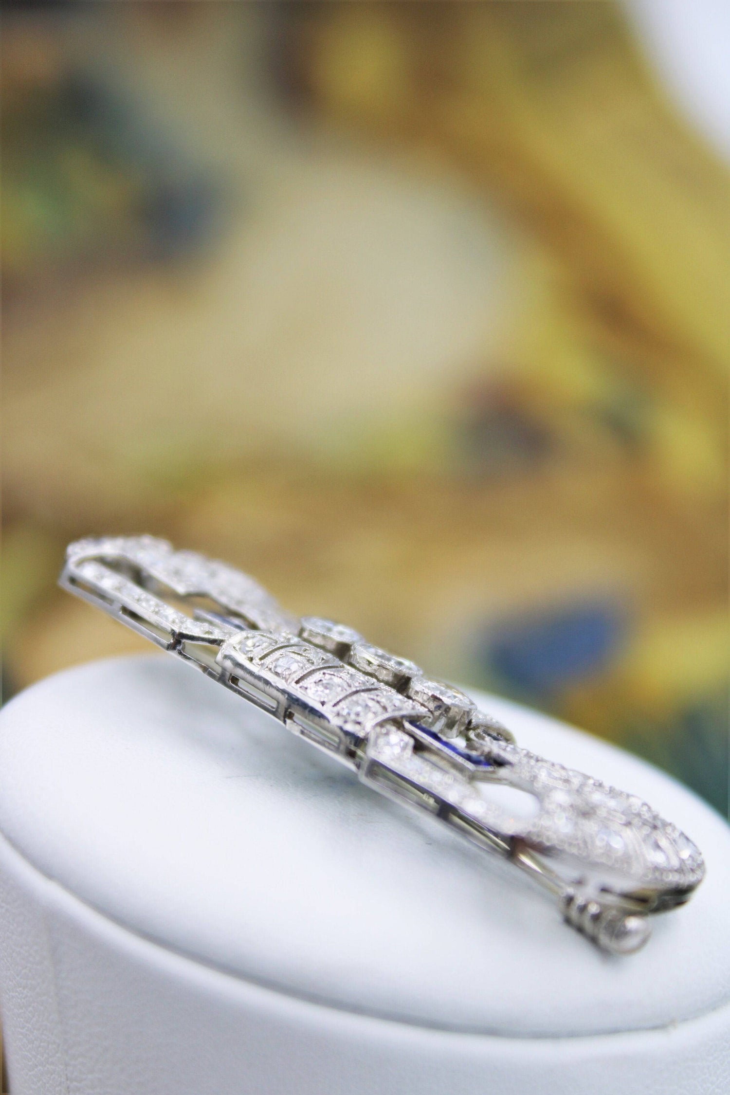 A very fine Platinum, Diamond and "Calibre cut" Sapphire "Art Deco" Brooch, Circa 1930. - Robin Haydock Antiques