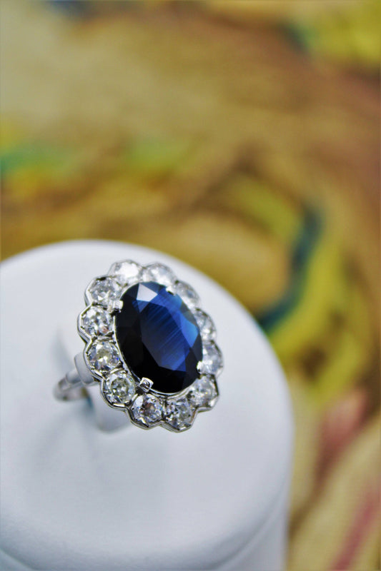 A remarkable Oval Sapphire & Diamond Cluster Ring mounted in Platinum, French, Circa 1935 - Robin Haydock Antiques