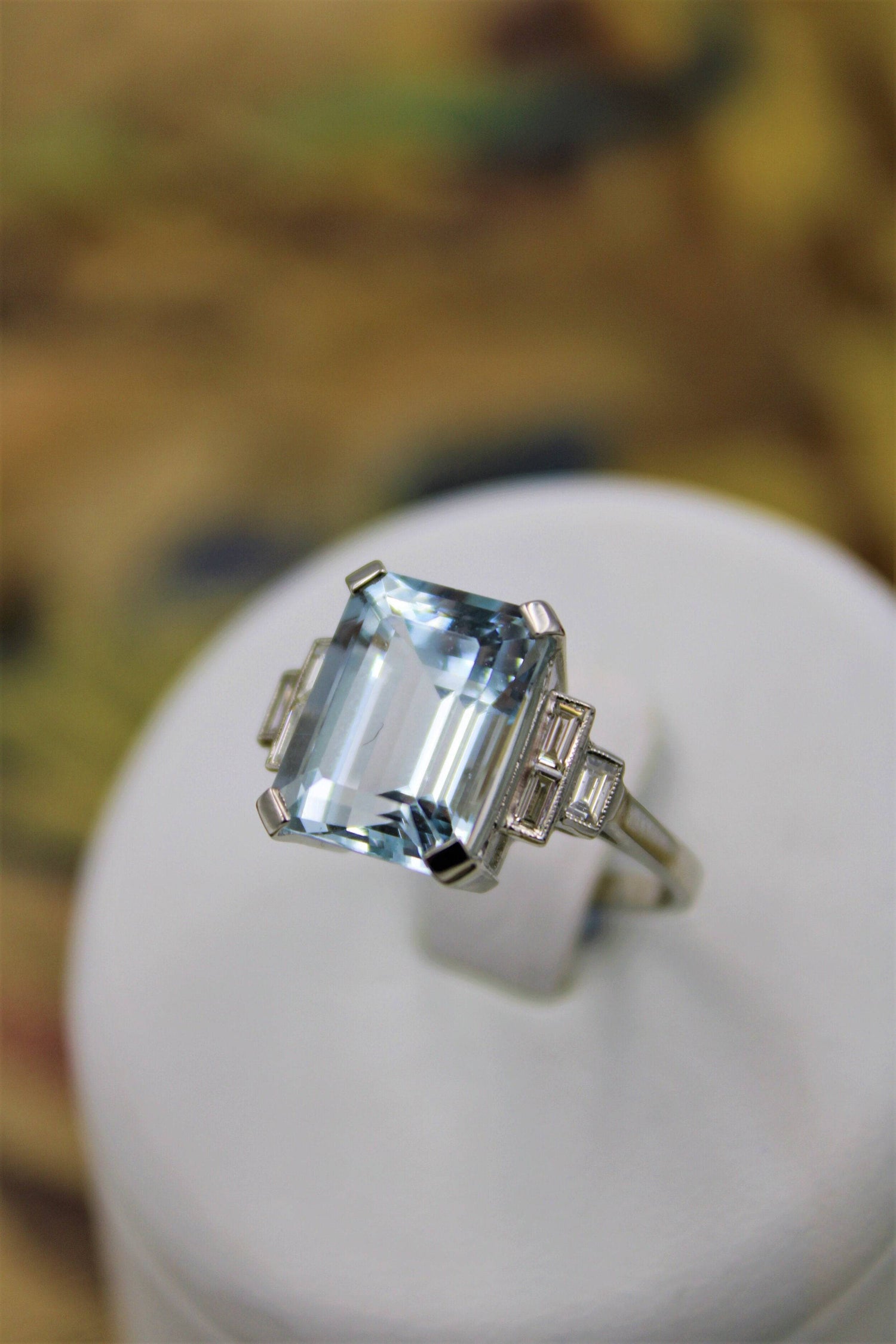 A very beautiful Platinum (marked) Aquamarine of approximately 8 Carats and Diamond stepped shouldered Ring, Mid 20th Century. - Robin Haydock Antiques