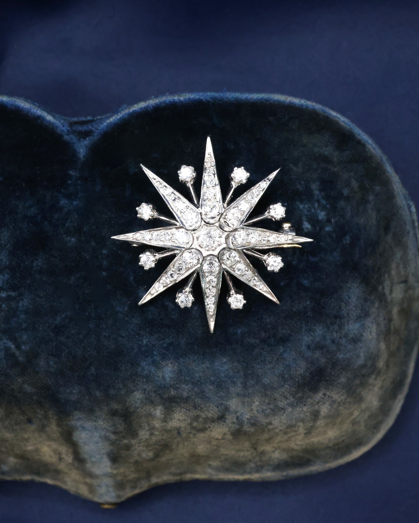 A fine Victorian Diamond Starburst Brooch, in 15ct Gold (silver tipped), with later Rhodium plating. Circa 1890.