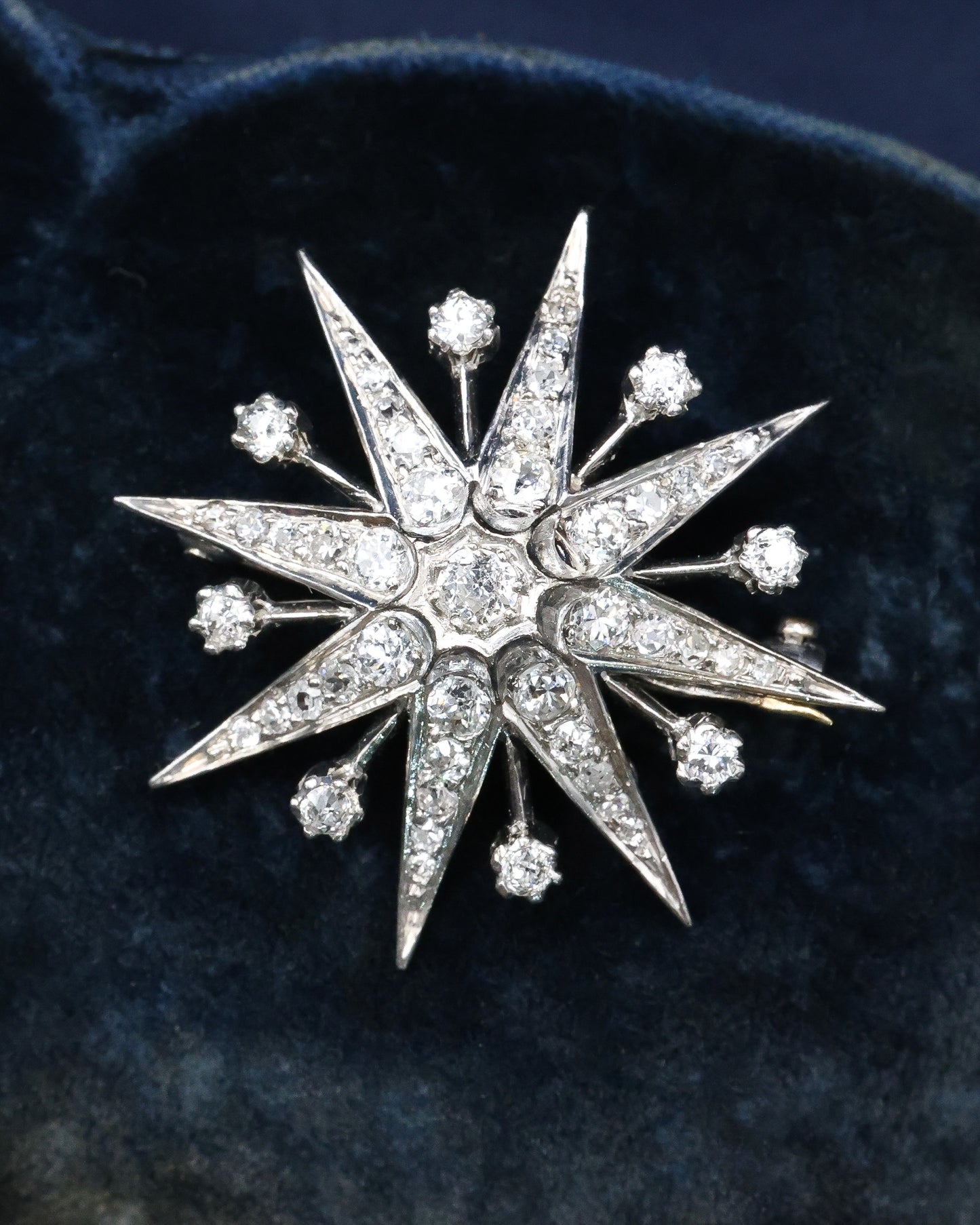 A fine Victorian Diamond Starburst Brooch, in 15ct Gold (silver tipped), with later Rhodium plating. Circa 1890.