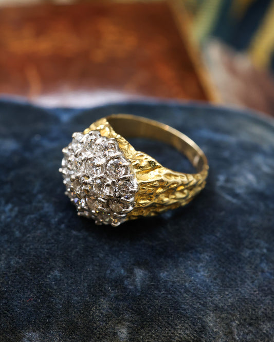 A Very Fine 18 Carat Yellow & White Gold (stamped), Diamond Cluster Ring, with an Abstract Bark Design to each Shoulder. Circa 1970.