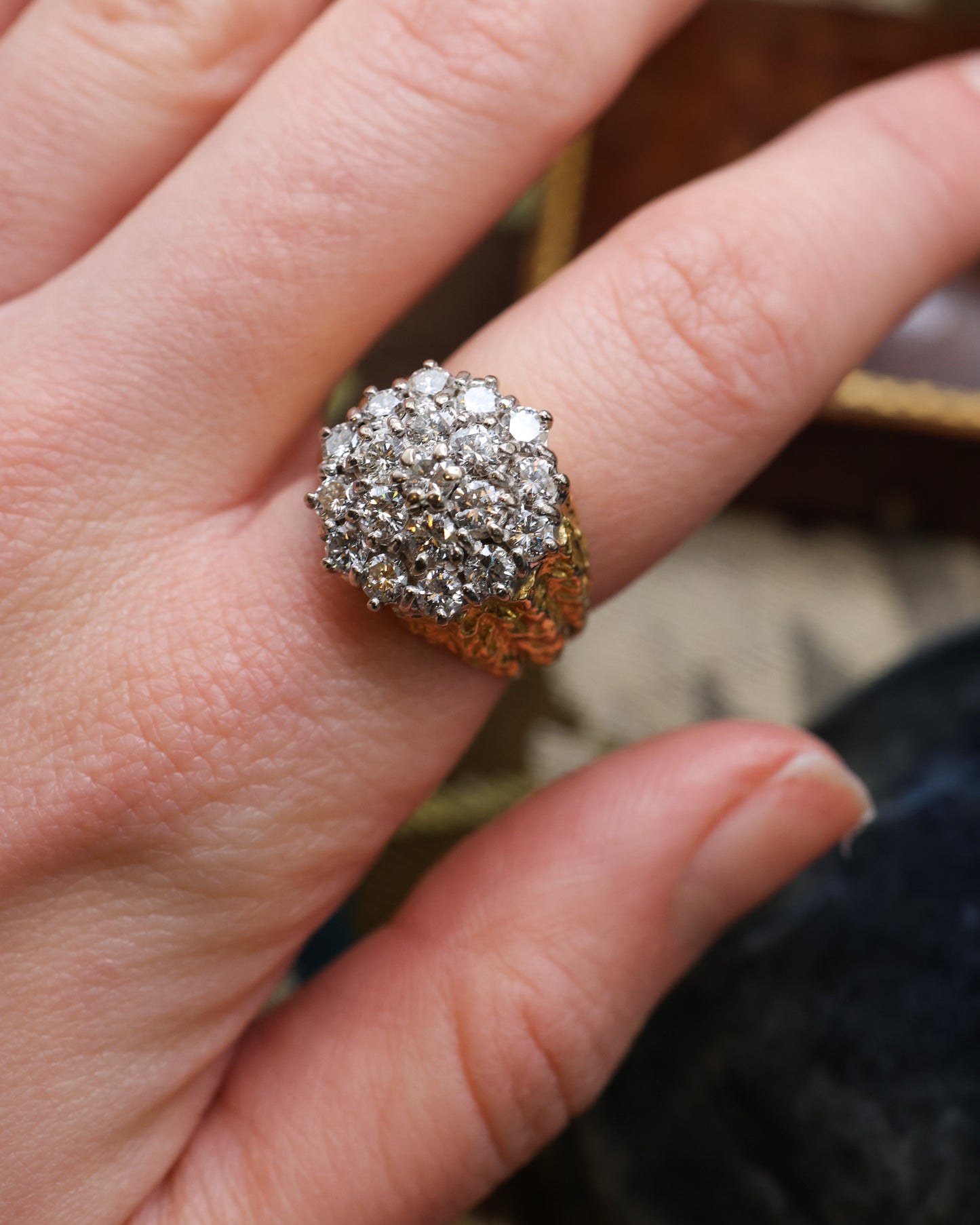 A Very Fine 18 Carat Yellow & White Gold (stamped), Diamond Cluster Ring, with an Abstract Bark Design to each Shoulder. Circa 1970.