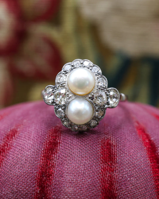 A very fine 18 Carat Gold and Platinum, Natural Salt Water "Button" Pearl and Diamond Ring in the Edwardian Style. English. Circa 1910