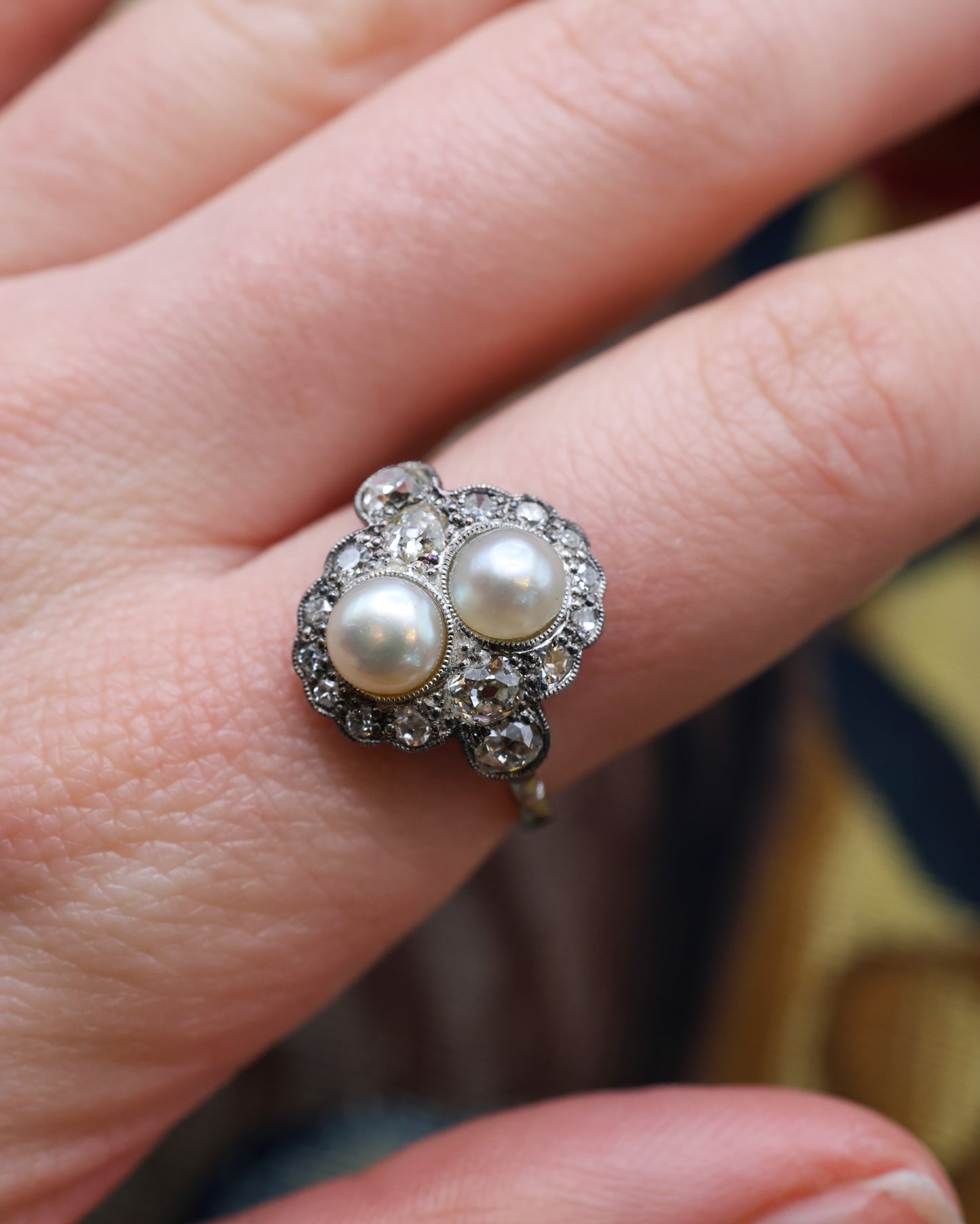 A very fine 18 Carat Gold and Platinum, Natural Salt Water "Button" Pearl and Diamond Ring in the Edwardian Style. English. Circa 1910