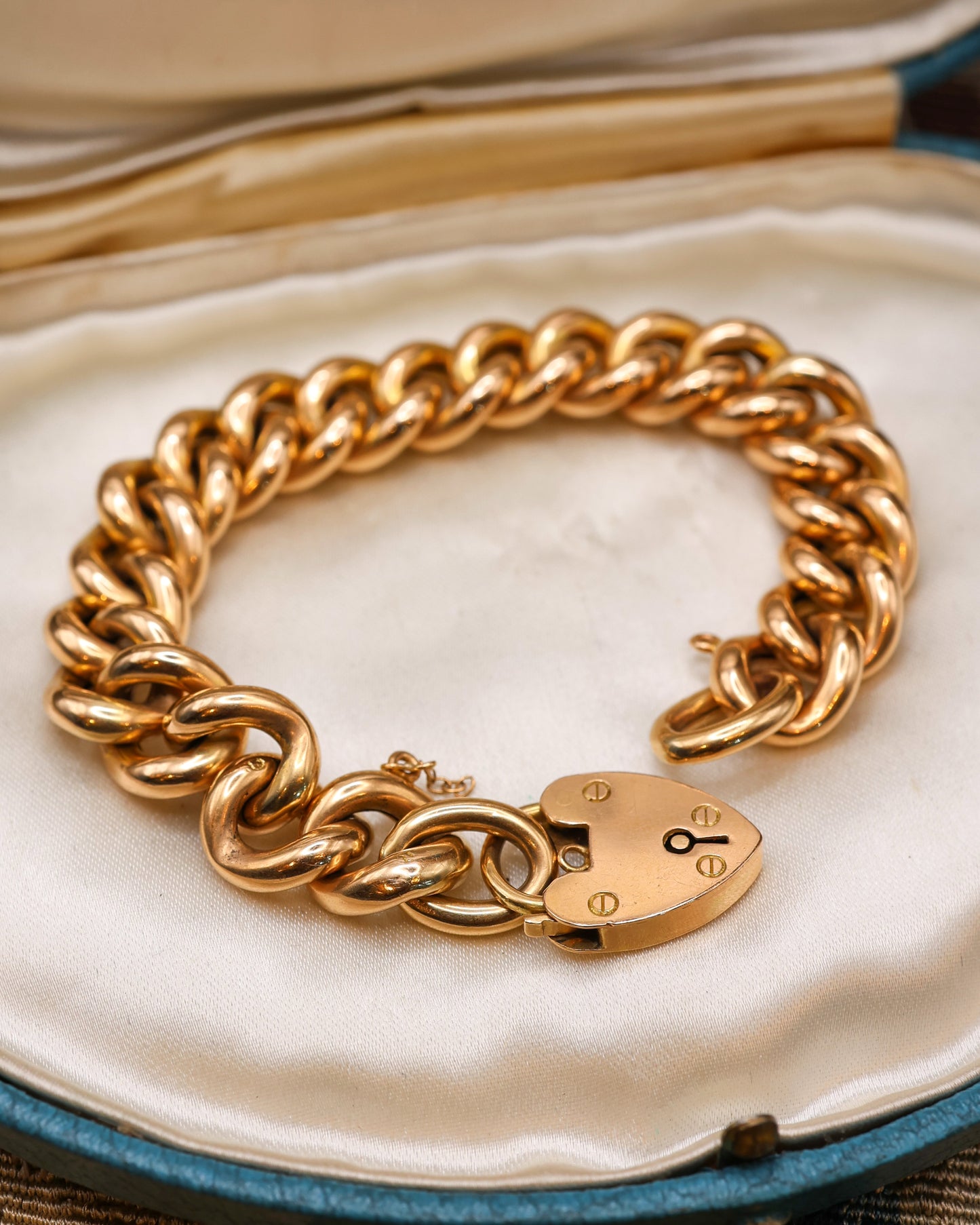 A very fine Victorian 15ct (stamped) Yellow Gold Curb Link Bracelet with Heart Lock and Safety Chain.   Circa 1890.