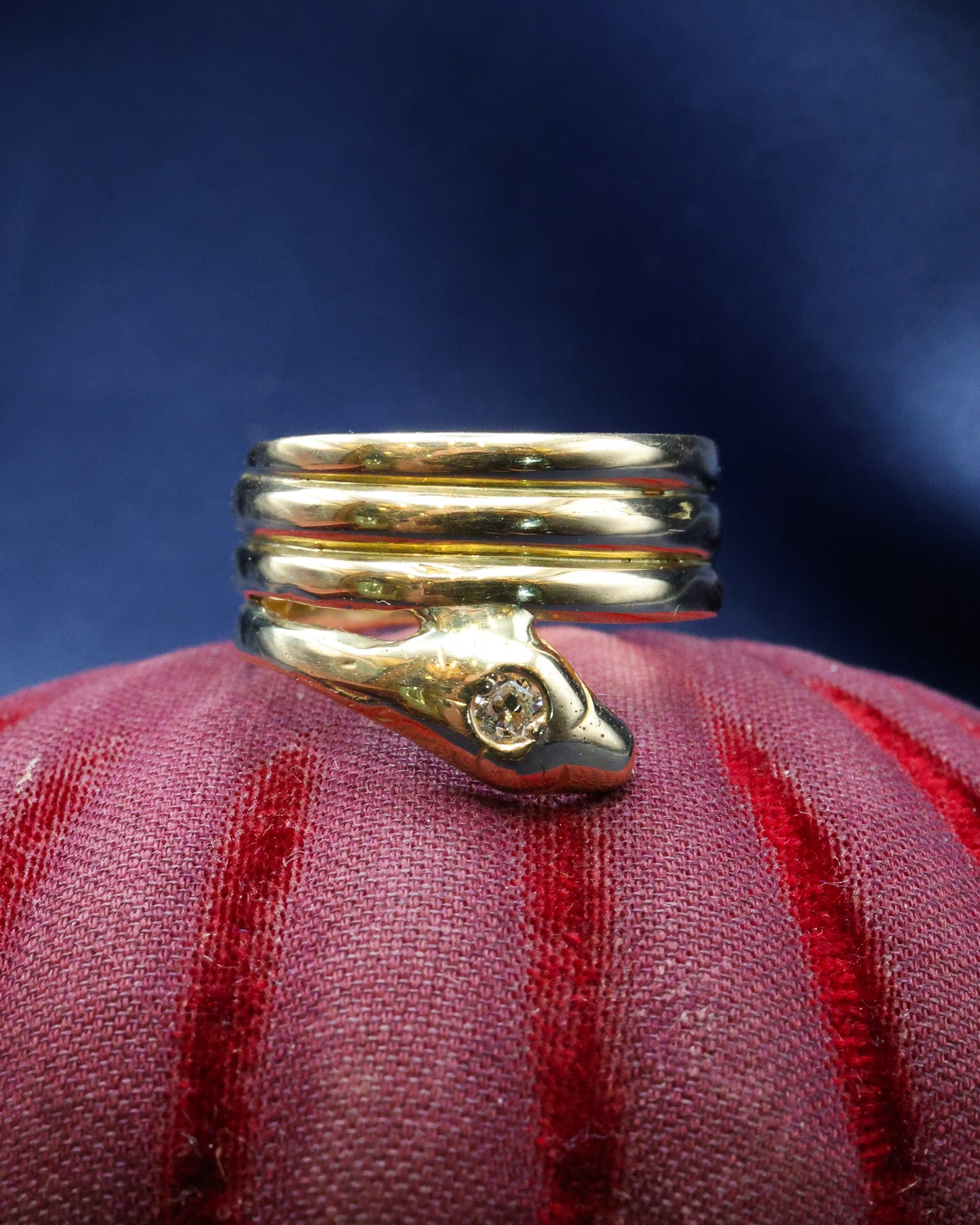 A very fine 18 Carat Yellow Gold (tested),Triple Coil Snake Ring, with an old cut Diamond of approximately 0.27 Carats, Circa 1910
