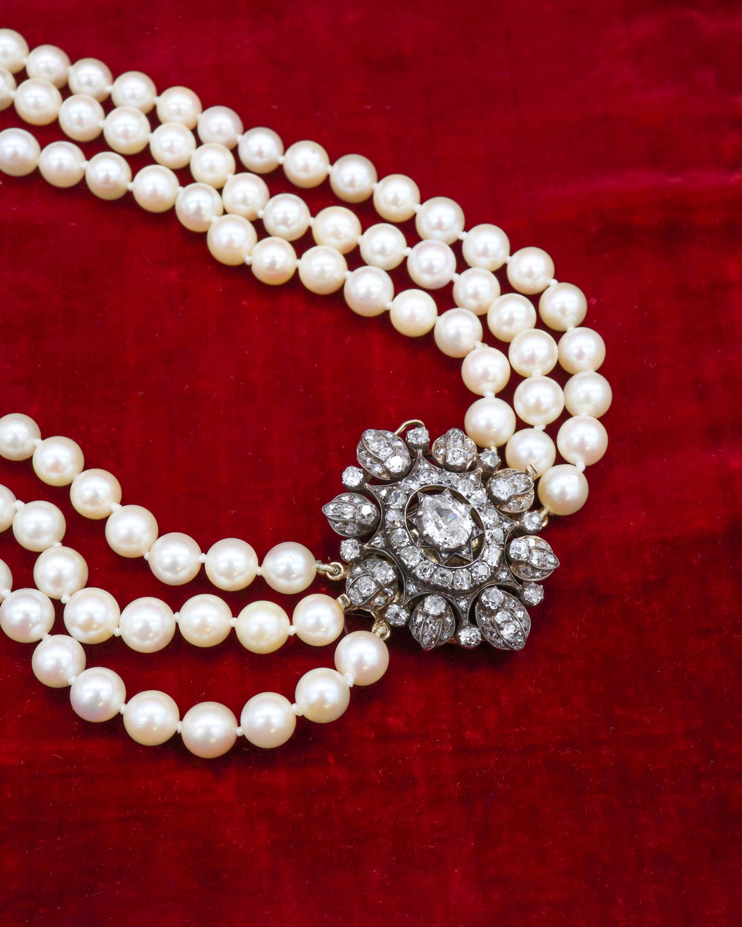 A very fine High Carat (tested), Yellow Gold, Silver tipped Oval Diamond Clasp, with double receipt fasteners for a triple row necklace of Cultured Pearls