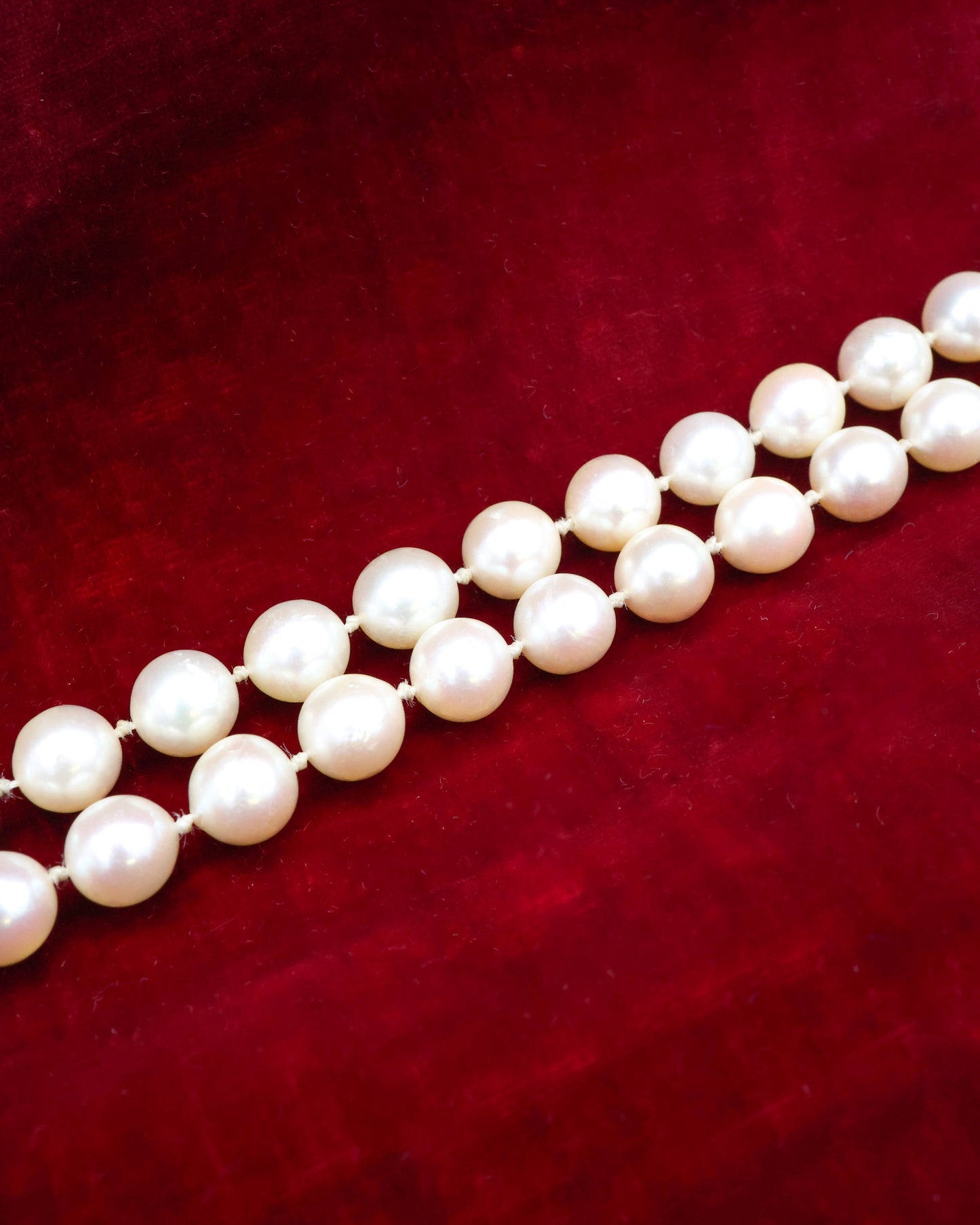 A fine Yellow Gold & Strung Cultured Pearl Necklace, set with four Round Cut Natural Sapphires (0.40 carats) and eighty three Oval and Near Shaped Cultured Pearls. Circa 1960