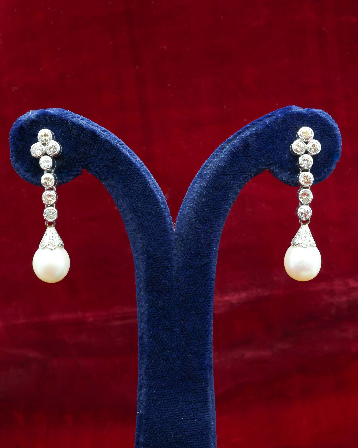 A fine pair of Platinum, Cultured Pearl & Diamond Drop Earrings. Circa 1950