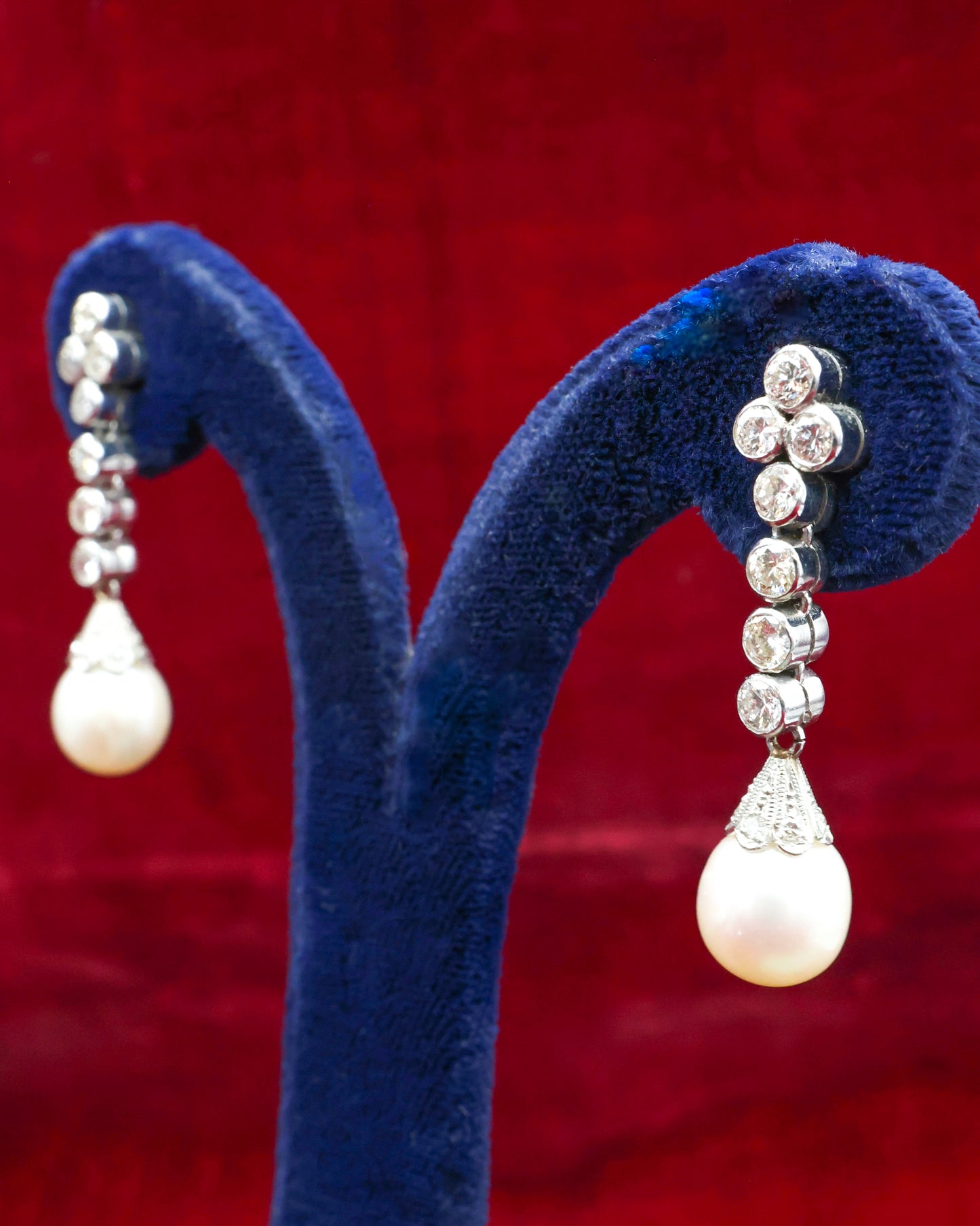 A fine pair of Platinum, Cultured Pearl & Diamond Drop Earrings. Circa 1950