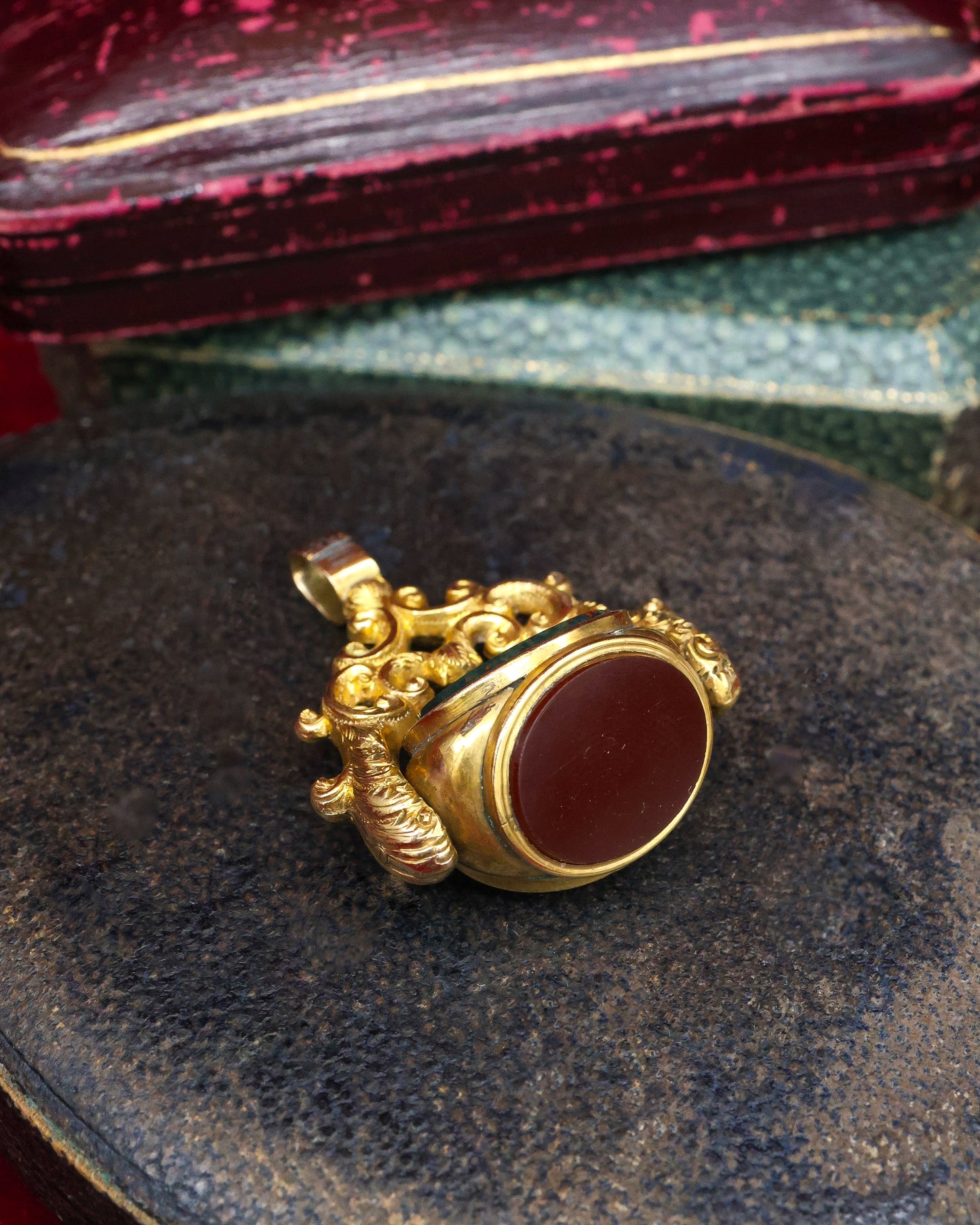 A late Georgian Pinchbeck, revolving, triple Seal, set with three oval (unmarked), Hardstones: Bloodstone, Carnelian & Carnelian with Viterous Lustre.  Circa. 1820