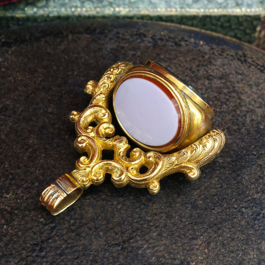 A late Georgian Pinchbeck, revolving, triple Seal, set with three oval (unmarked), Hardstones: Bloodstone, Carnelian & Carnelian with Viterous Lustre. Circa. 1820